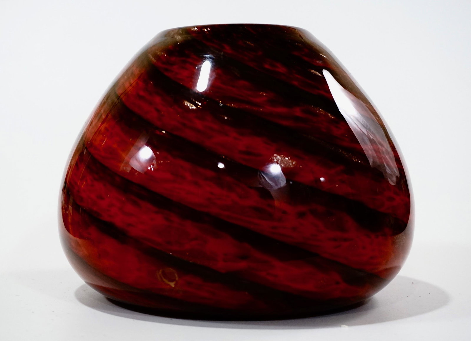 Aventurine Red Twist Glass Cased Vase Drilled: Aventurine Red Twist Glass Cased Vase Drilled Approximately 6 1/16 x 8 1/2 inches in diameter; 3 inches in diameter opening.