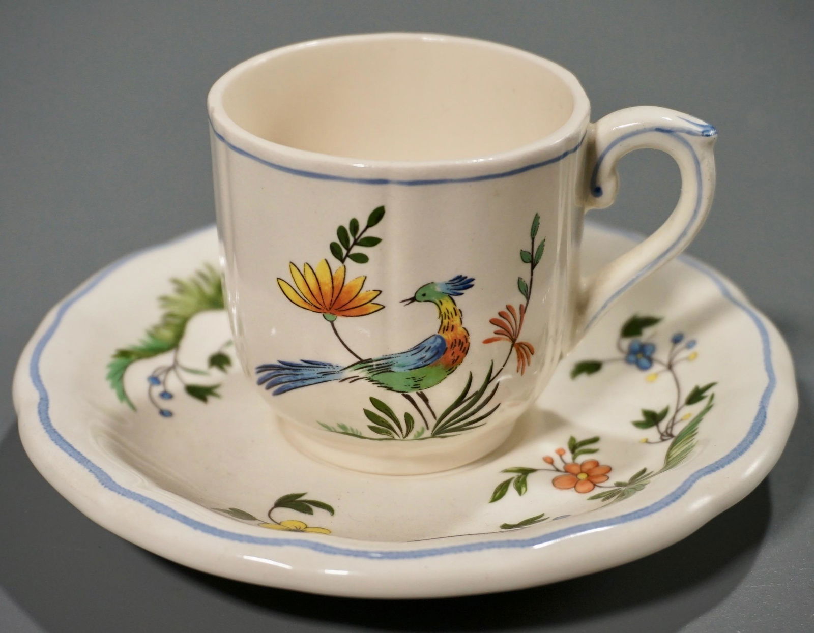 Gien Paradise Bird French Pottery Demitasse Cup Saucer: Gien Paradise Bird French Pottery Demitasse Cup Saucer Set France Oiseaux de Paradis Bird of Paradise Cup is about 3 3/6 x 2 3/8 x 2 1/8 inches tall; saucer is approximately 5 3/16 inches in diameter.