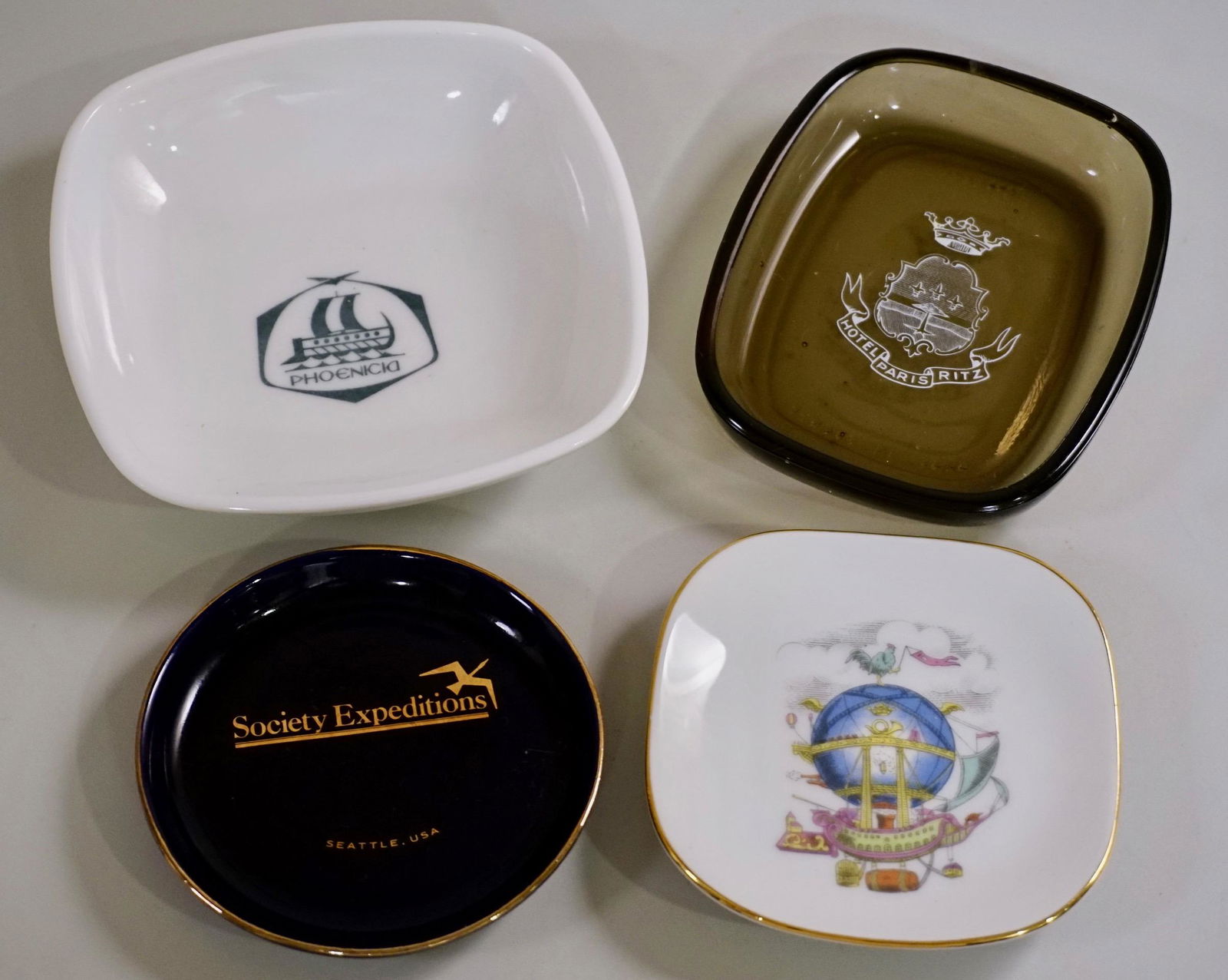 Vintage Ashtrays Soap Dishes Including Alitalia by: Vintage Ashtrays Soap Dishes Including Alitalia by Ginori Approximately from 3 1/4 inches in diameter to 4 11/16 x 4 11/16 inches.