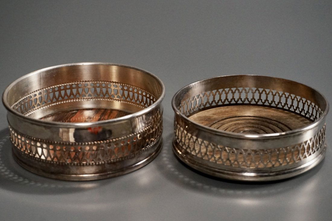 Wine Bottle Coaster Lot of 2 Fret Pierced Gallery: Property of a retired San Francisco antique dealer. Wine Bottle Coaster Lot of 2 Fret Pierced Gallery Silver Plate Approximately 5 x 5 1/16 inches in diameter.