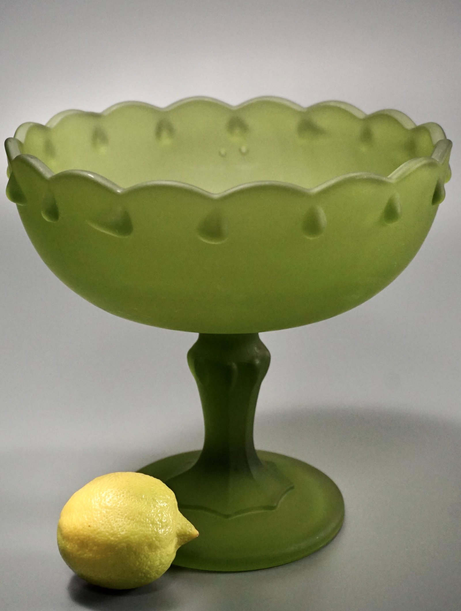 Frosted Green Large Compote Satin Teardrop Footed Dish: Frosted Green Large Compote Satin Teardrop Footed Dish Approximately 7 3/4 inches in diameter x 7 1/4 inches tall.