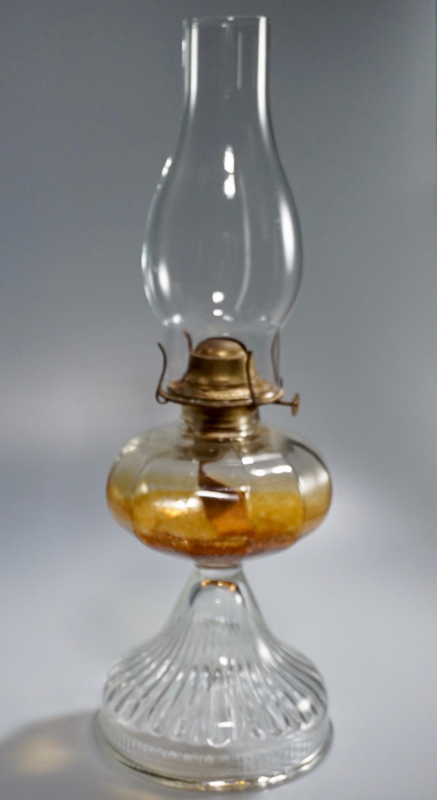 Molded Glass Vintage Kerosene Lamp: Molded Glass Vintage Kerosene Lamp Approximately 10 7/16 inches tall up to the burner; 17 3/4 inches tall overall.