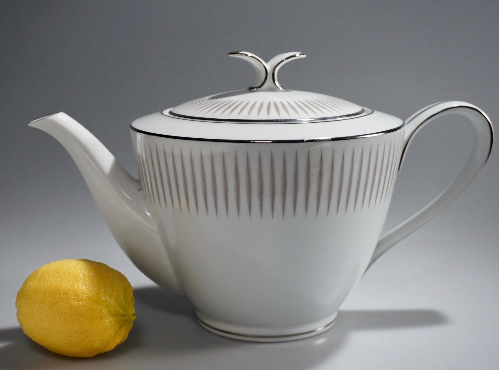 Noritake China Biarritz White Tea Pot US Patent: Noritake China Biarritz White Tea Pot US Patent Platinum Trim Approximately 10 x 5 11/16 x 6 inches tall overall.