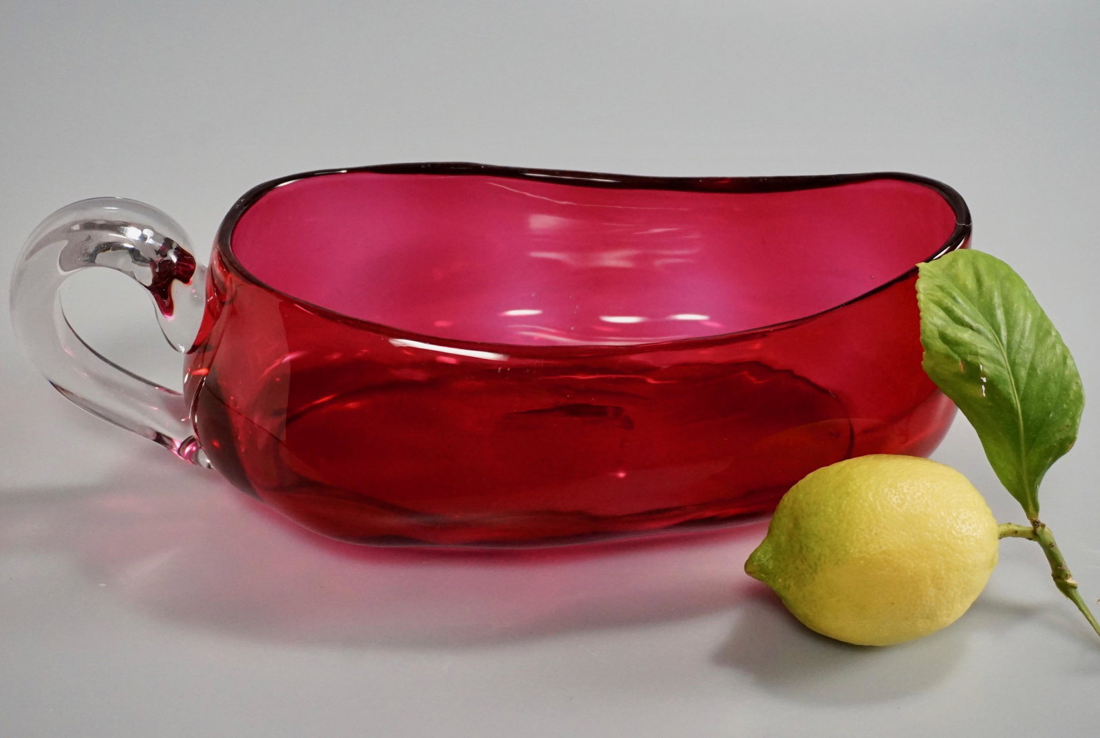 Cranberry Sauce Boat Antique Art Glass Oval Bowl with: Cranberry Sauce Boat Antique Art Glass Oval Bowl with Handle Polished Pontil Approximately 9 7/8 x 5 x 3 3/8 inches tall.