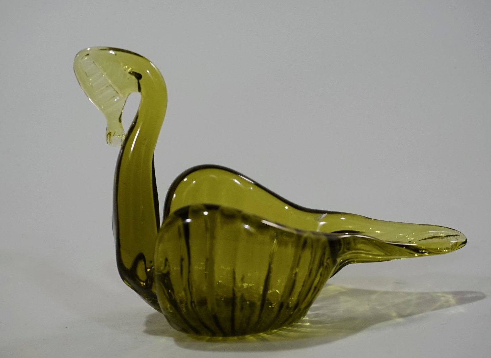 Green Art Glass Swan Salt Cellar: Green Art Glass Swan Salt Cellar Approximately 4 3/8 x 2 1/2 x 2 13/16 inches.