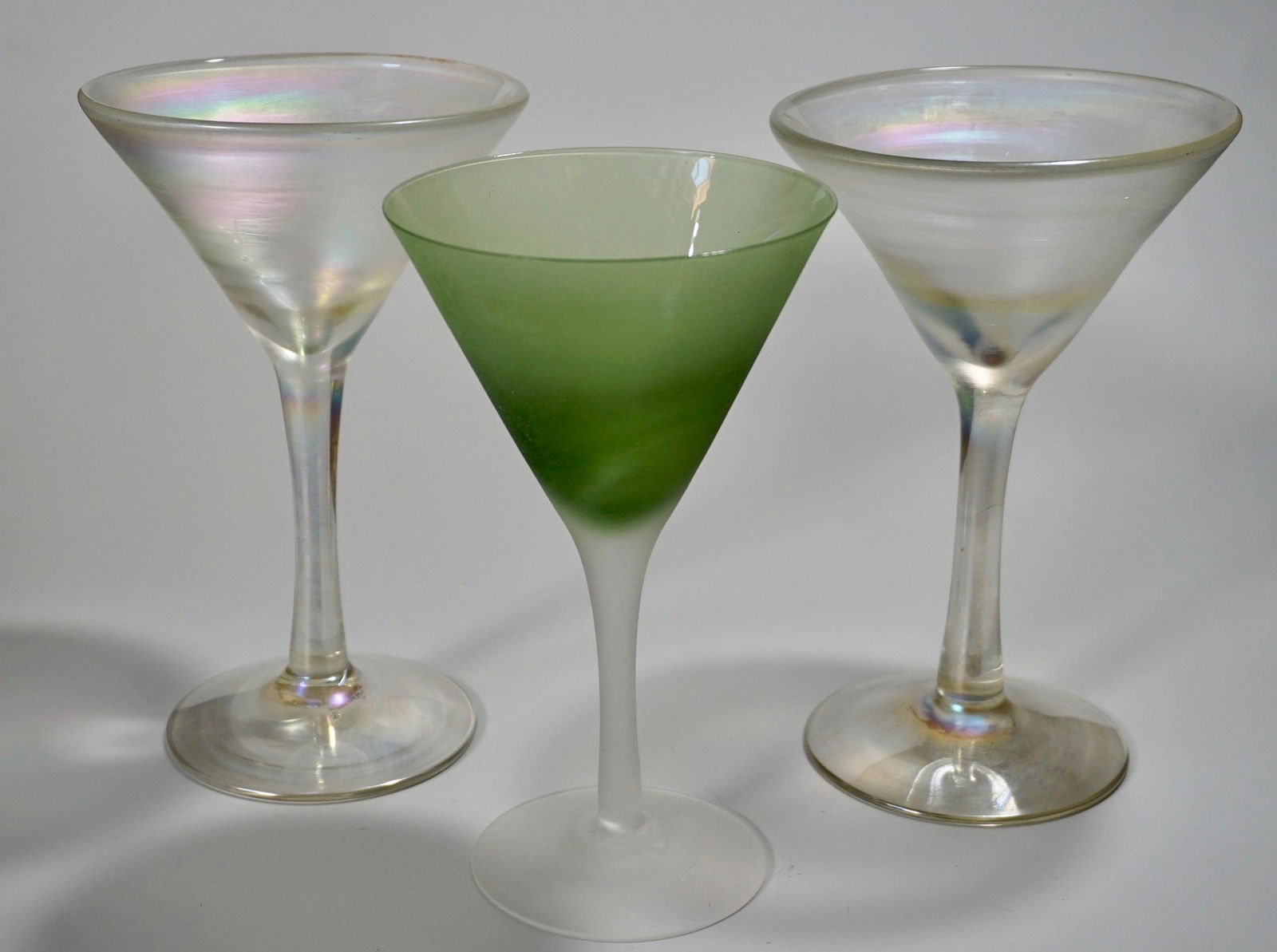Pair Iridescent Glass Martini & Green Frosted Glass Lot: Pair Iridescent Glass Martini & Green Frosted Glass Lot of 3 Approximately 8 1/8 inches tall and 5 1/4 inches in diameter. Green frosted glass is about 7 7/8 inches tall x 4 9/16 in diameter.