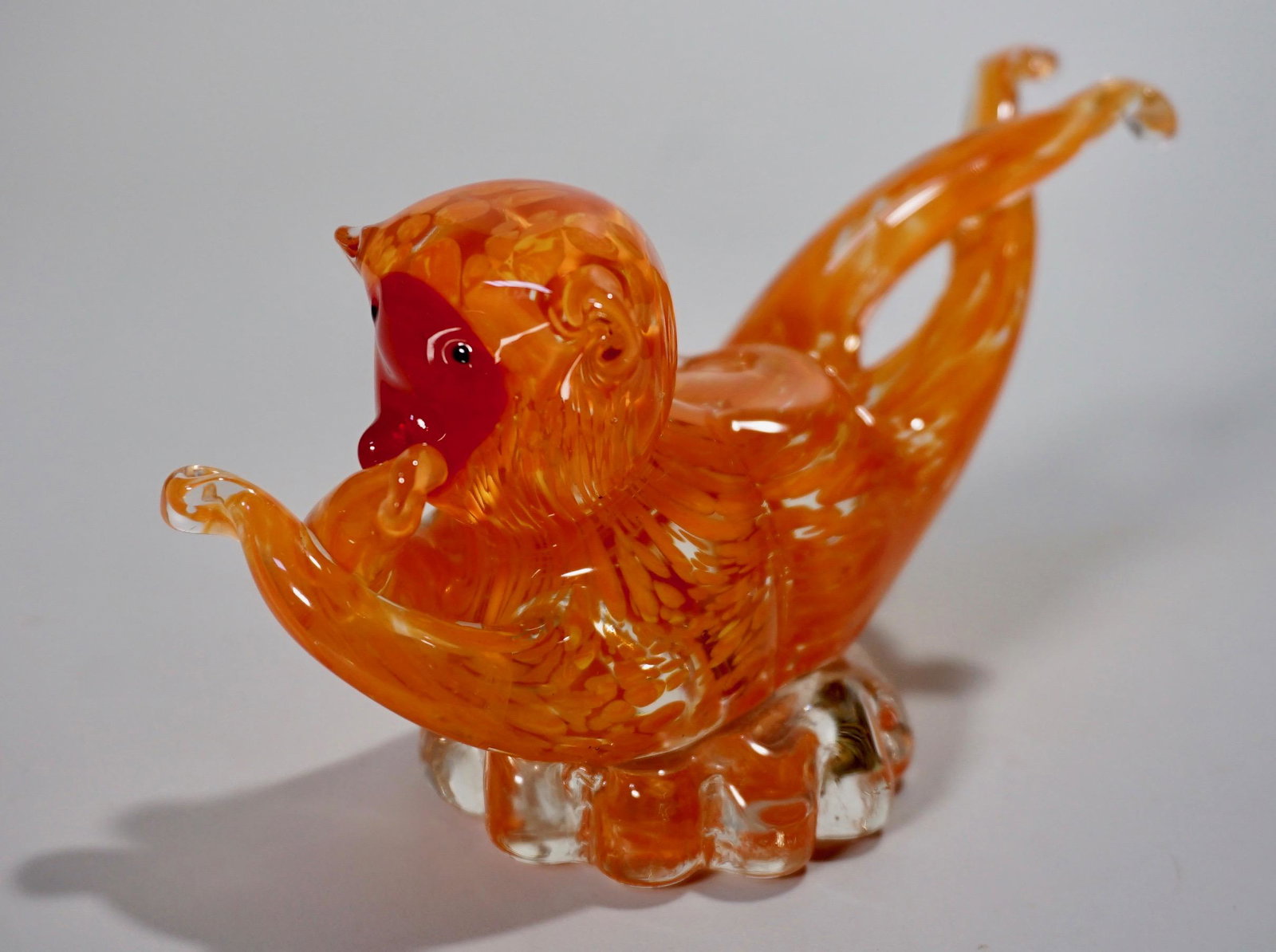 Orange Monkey Figurine Art Glass Paper Weight: Orange Monkey Figurine Art Glass Paper Weight Approximately 5 3/8 x 2 5/16 x 3 inches tall.