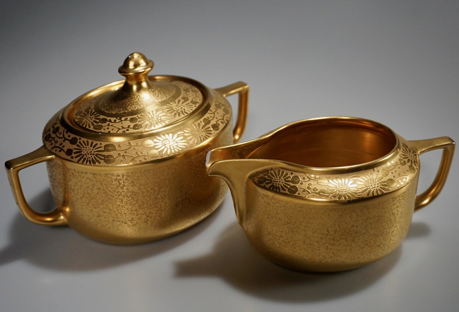 22k Gold Encrusted Studio Decorated Vintage Creamer: 22k Gold Encrusted Studio Decorated Vintage Creamer Sugar Set Creamer is approximately 5 9/16 x 3 3/16 x 2 7/16 inches tall; sugar is about 6 1/2 x 3 7/8 x 4 5/16 inches tall overall.