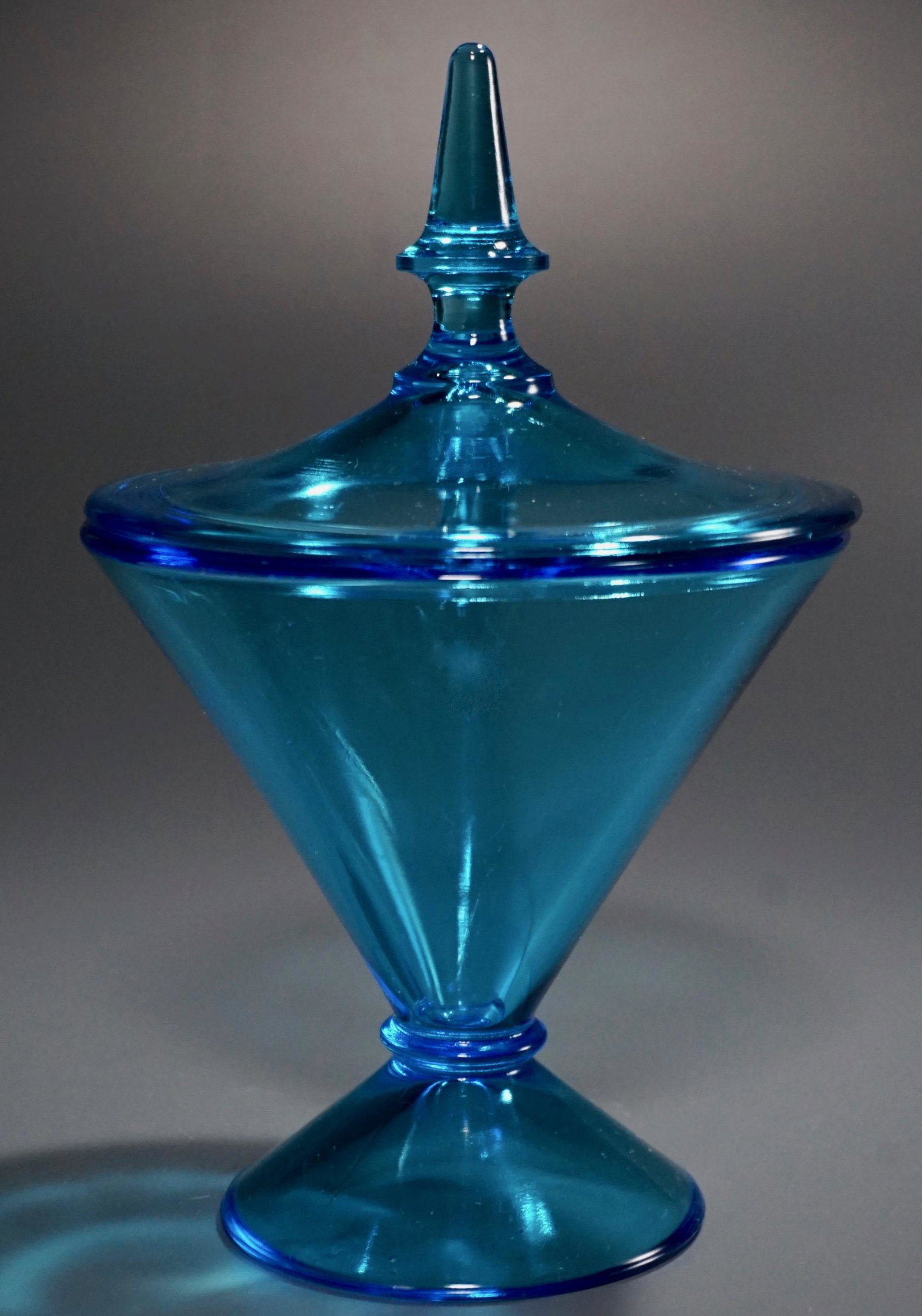 Mid Century Blue Glass Apothecary Footed Jar Spike: Mid Century Blue Glass Apothecary Footed Jar Spike Finial Lid Approximately 8 inches tall overall.