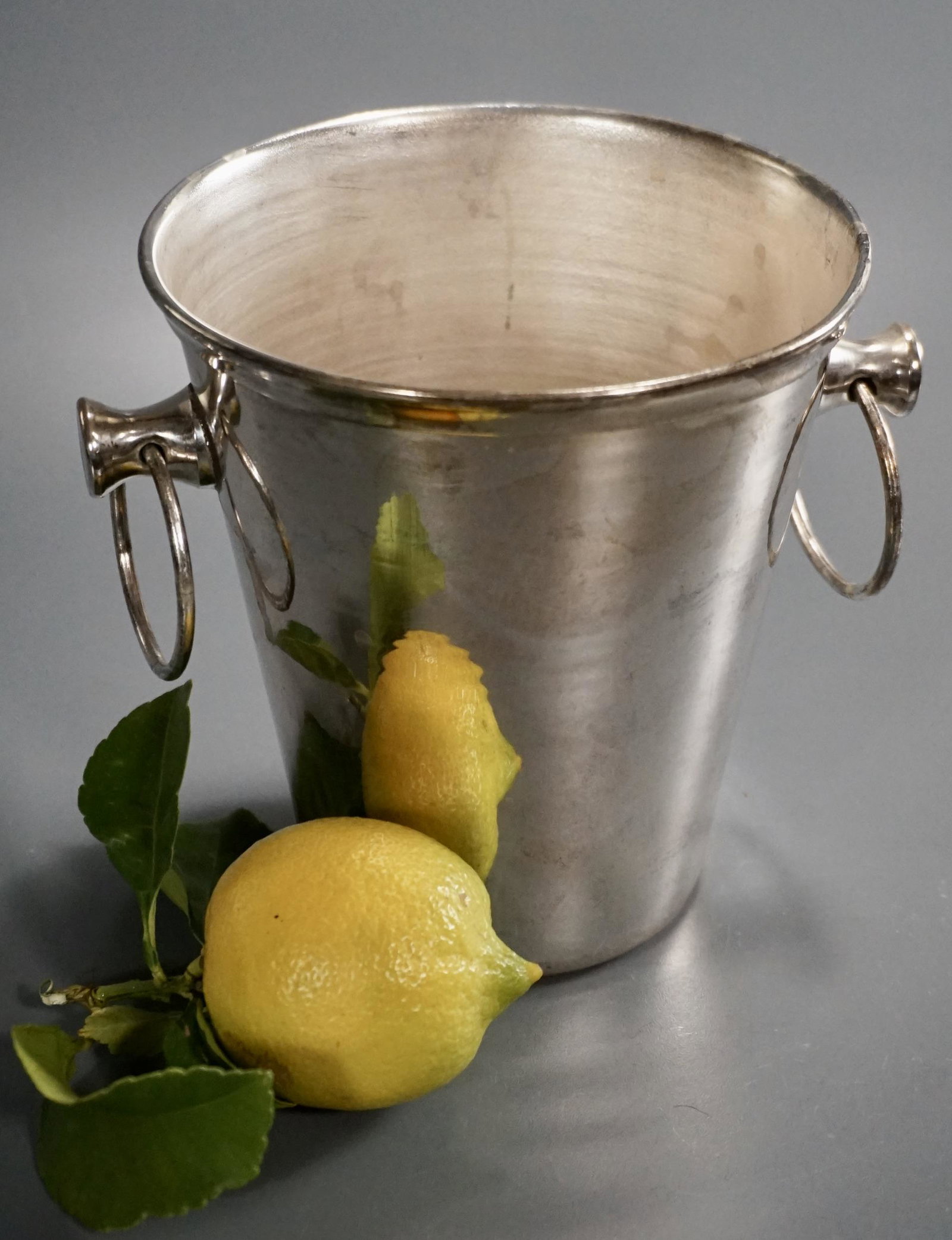 Silver Plate Ice Bucket Unmarked Wine Bottle Cooler: Property of a retired San Francisco antique dealer. Silver Plate Ice Bucket Unmarked Wine Bottle Cooler Approximately 6 3/16 x 5 5/16 x 5 5/8 inches tall.