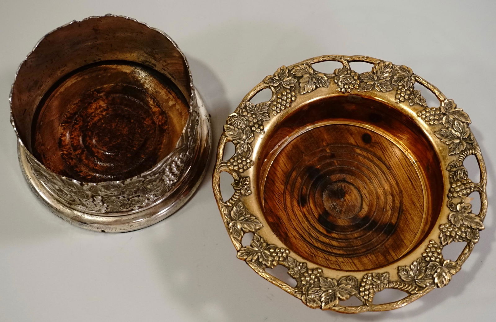 Vintage Wine Bottle Coaster Grape Vines Design Lot of: Vintage Wine Bottle Coaster Grape Vines Design Lot of 2 Approximately 5 7/16 inches in diameter with 3 1/2 inches in diameter opening and 4 1/8 inches in diameter with 3 1/4 inches in diameter opening