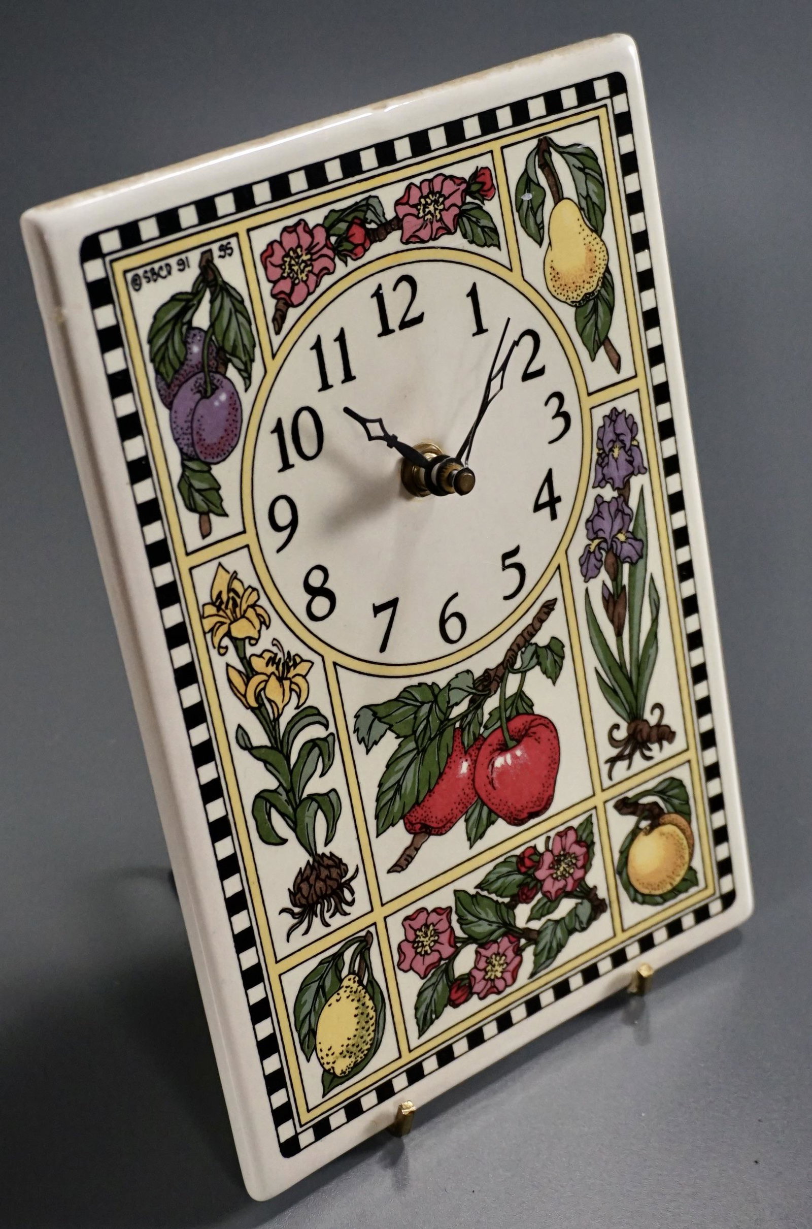 Garden Fruits Flowers Kitchen Tile Clock Battery: Garden Fruits Flowers Kitchen Tile Clock Battery Operated Movement Approximately 8 7/8 x 6 inches.
