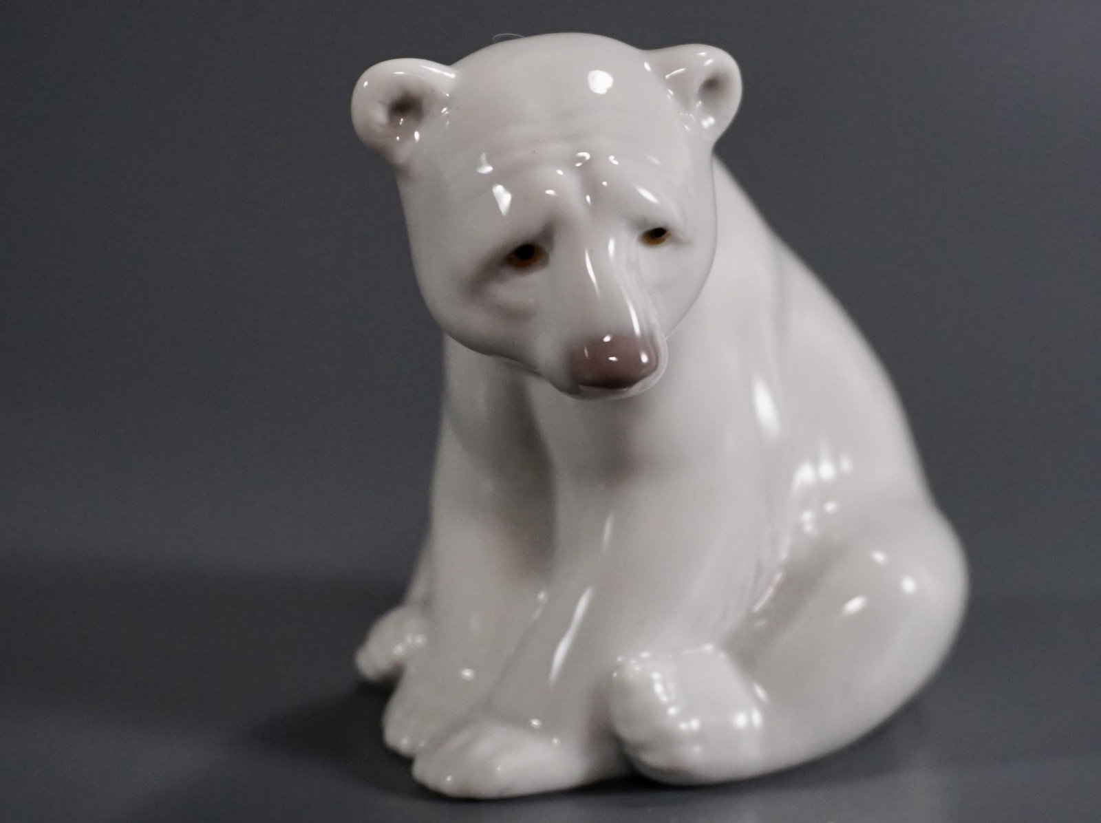 Lladro Porcelain Seated Polar Bear Figurine: Lladro Porcelain Seated Polar Bear Figurine Approximately 3 3/8 inches tall.