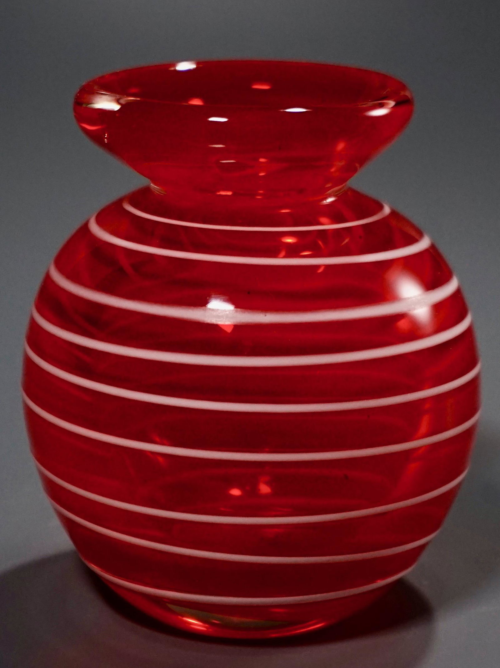 Mid Century Orange Art Glass Blown Vase White Tread: Mid Century Orange Art Glass Blown Vase White Tread Polished Pontil Approximately 3 1/2 inches tall.