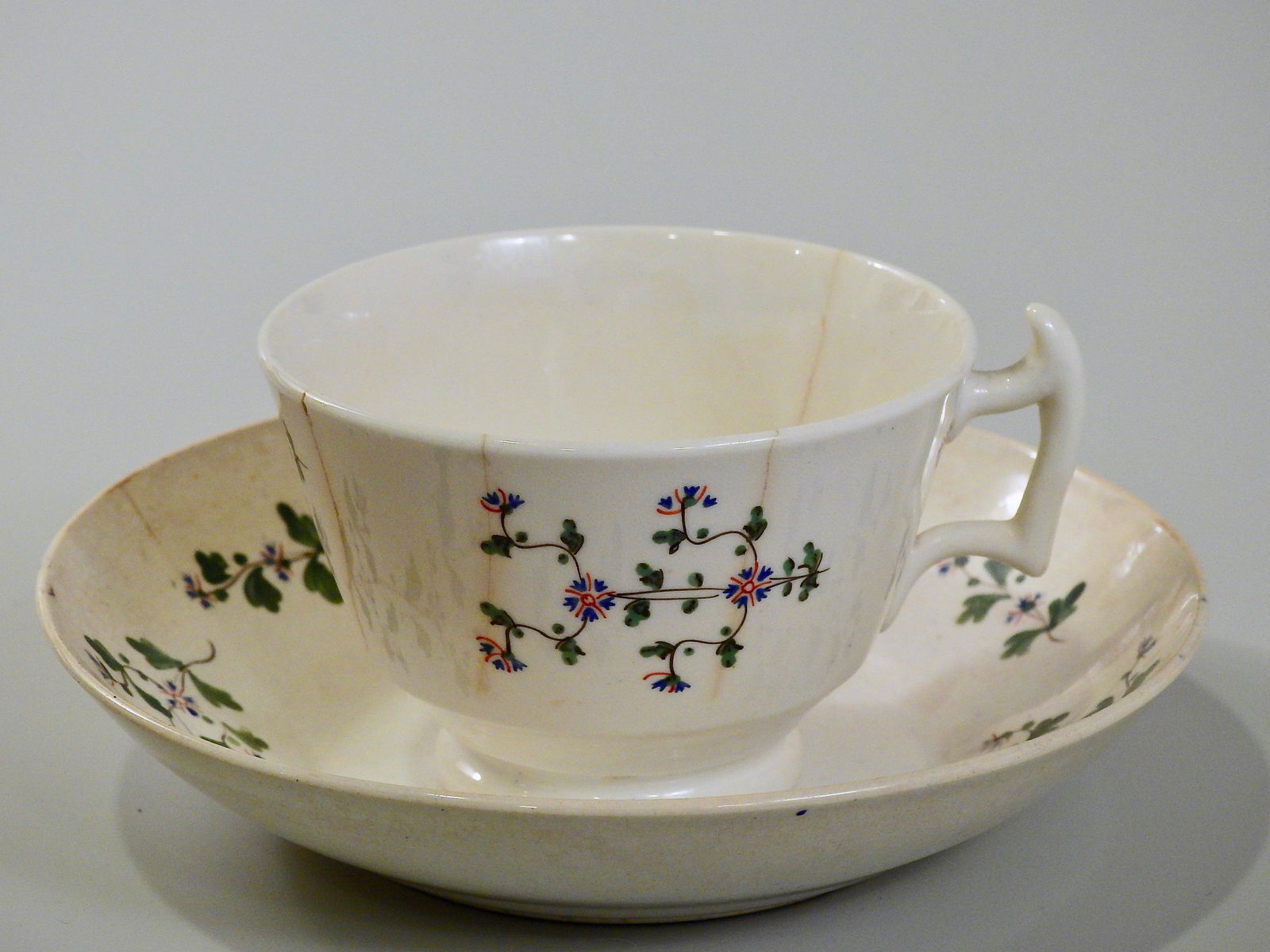 Antique c1800 English Early China Tea Cup And Deep: Antique c1800 English Early China Tea Cup And Deep Saucer Saucer is approximately 5 7/8 inches in diameter; cup is 2 1/2 x 3 3/8 inches in diameter.