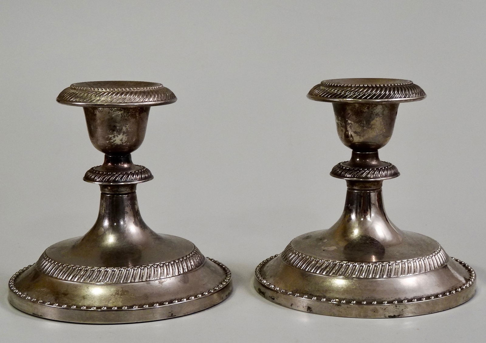 Pair Silver Tone Metal Candleholders: Pair Silver Tone Metal Candleholders Approximately 4 1/8 inches tall on 4 1/2 inches in diameter base.