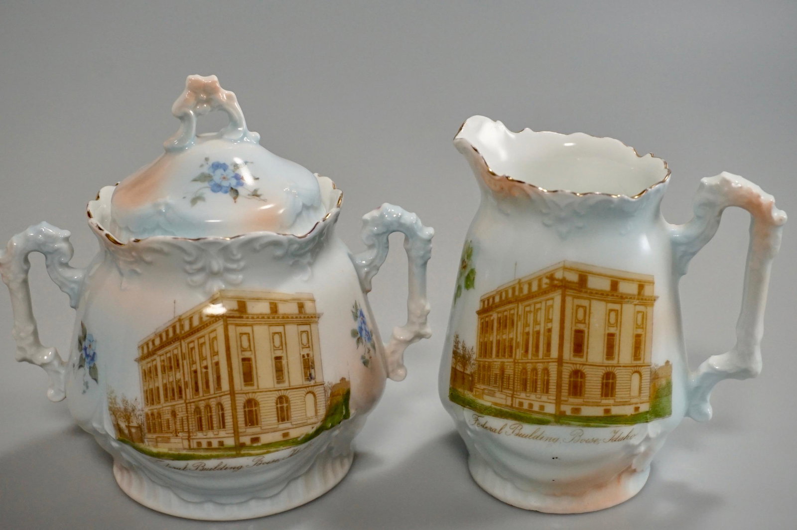 Boise Book & Music Co Federal Building Boise Idaho: Boise Book & Music Co Federal Building Boise Idaho Antique Historical Porcelain Creamer Sugar Set by Hermann Ohme Porcelain Factory Niedersalzbrunn Silesia Germany Creamer is about 3 5/8 x 2 7/8 x 4 1