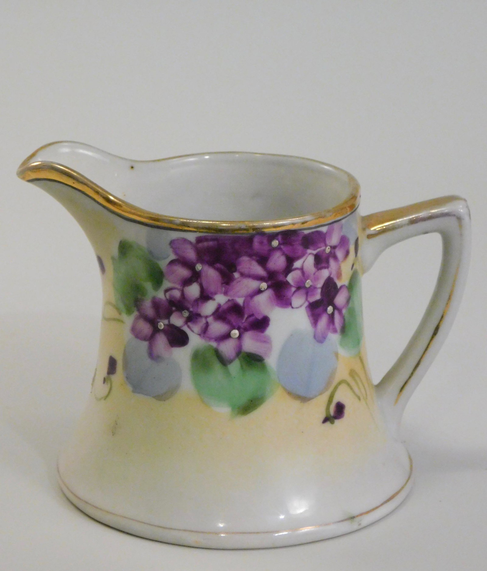 Vintage Nippon Porcelain Creamer Hand Painted: Vintage Nippon Porcelain Creamer Hand Painted Approximately 4 7/8 x 3 5/8 inches tall.
