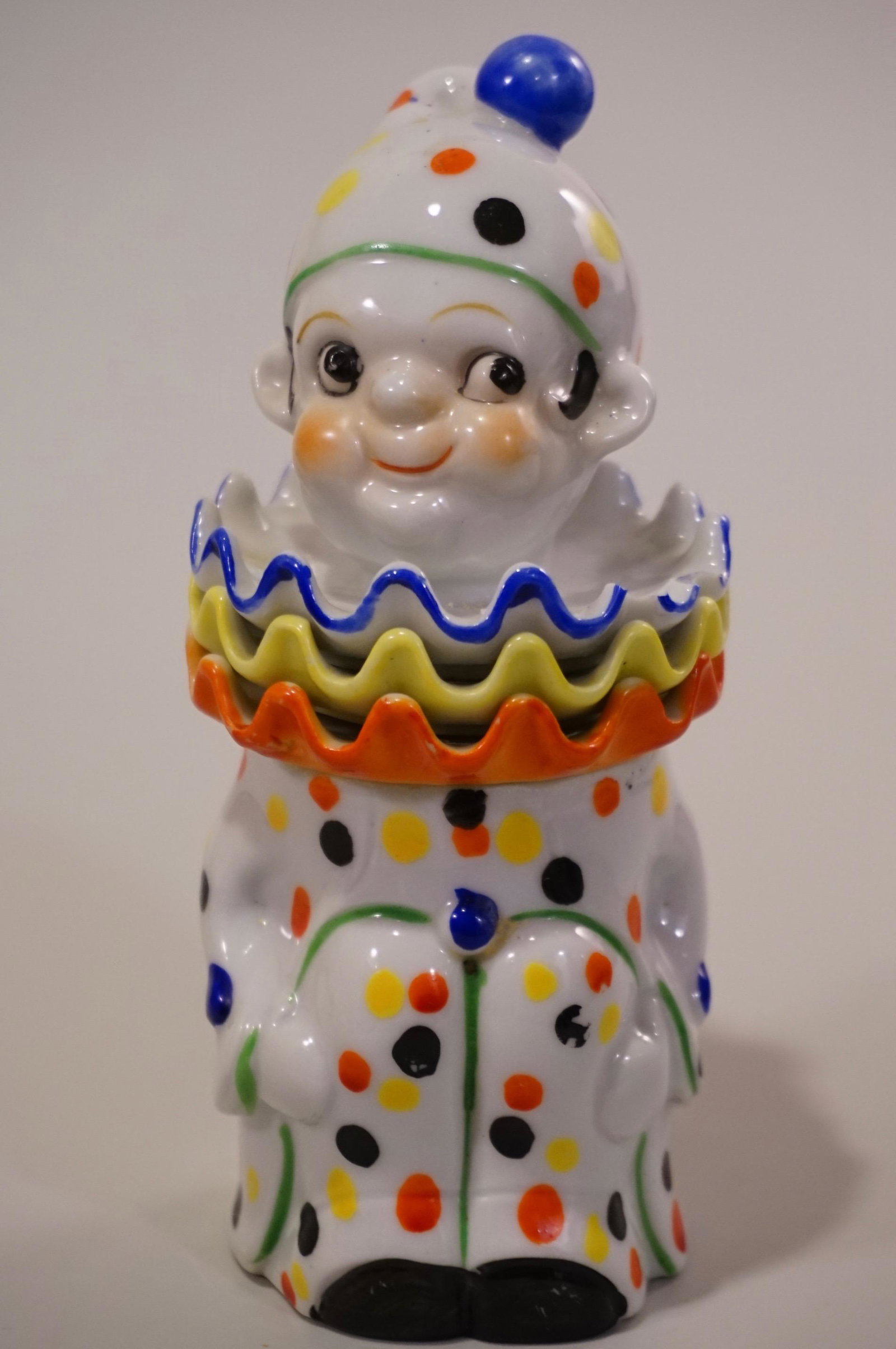 Clown Collar Rosette Porcelain Jar: Clown Collar Rosette Porcelain Jar c 1930 Approximately 6 1/2 inches tall, rosettes are 2 3/4 inches in diameter.