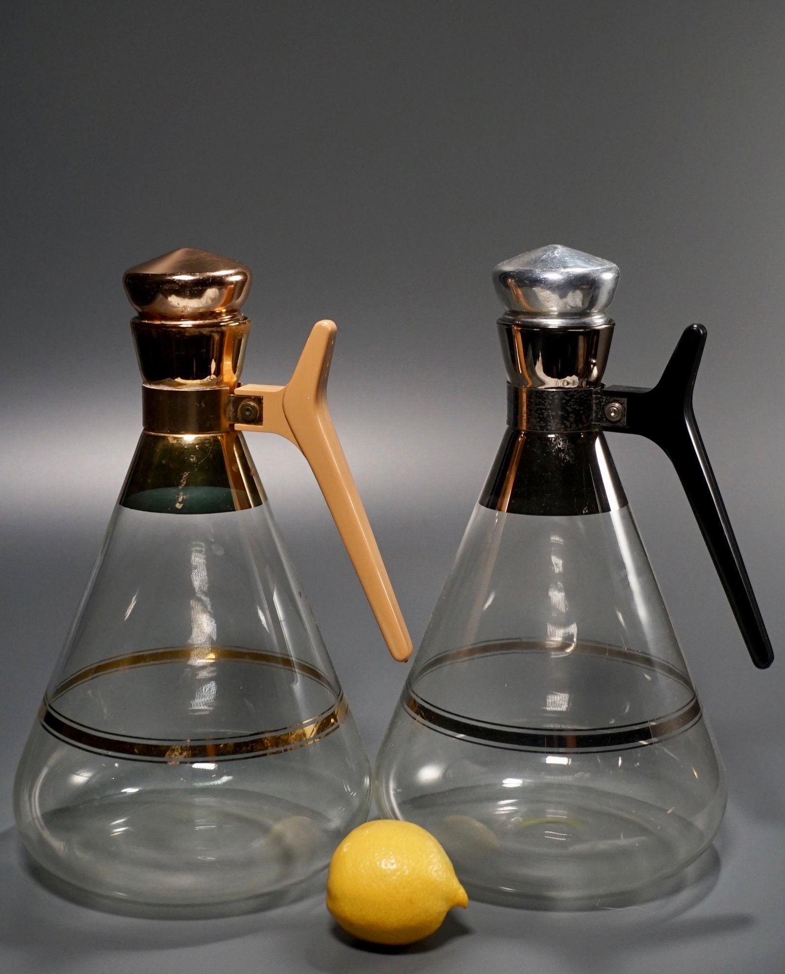 Vintage Mid Century Glass Carafe Decanter Lot of 2: Vintage Mid Century Glass Carafe Decanter Lot of 2 Approximately 11 3/8 inches tall.