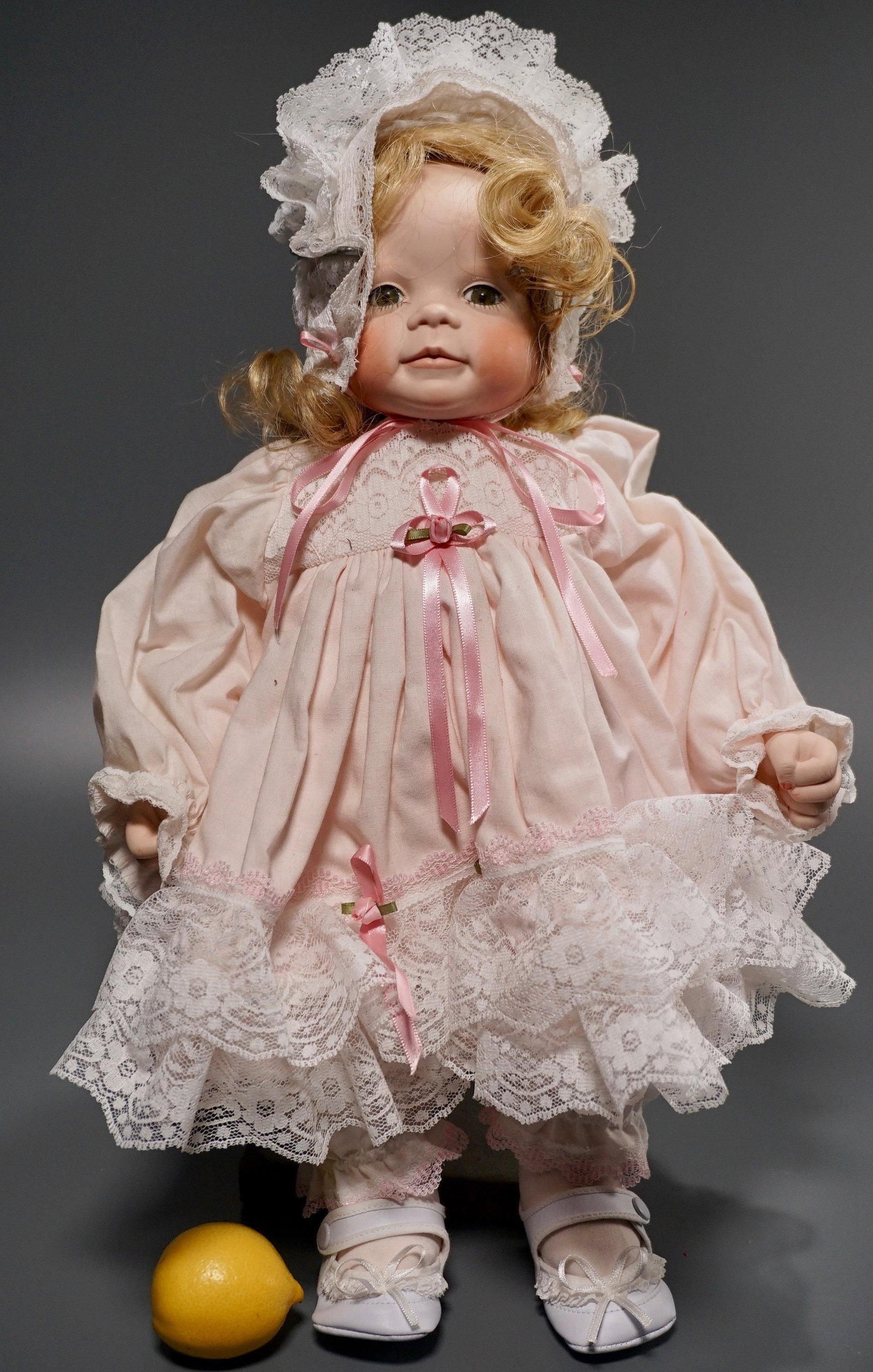Porcelain Head Glass Eyes Baby Doll: Porcelain Head Glass Eyes Baby Doll Approximately 18 1/2 inches tall.