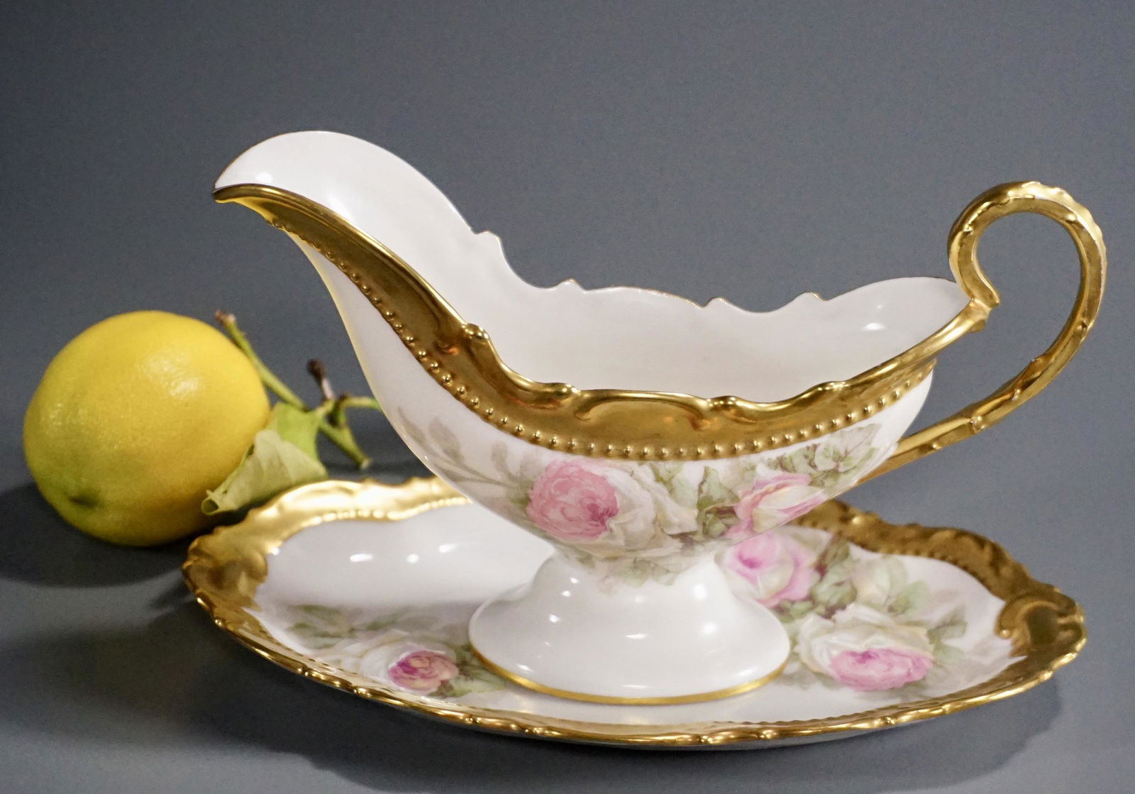 French Limoges Coronet Porcelain Gravy Boat Underplate: French Limoges Coronet Porcelain Gravy Boat Underplate Gravy boat is approximately 8 1/8 x 1 7/8 x 4 3/16 inches tall, underplate is about 7 9/16 x 4 11/16 inches.