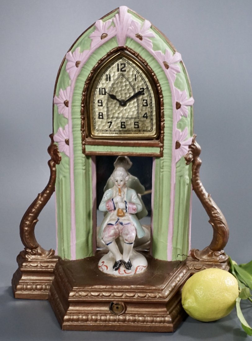 Art Deco Period Figural Wind Up Clock: Art Deco Period Figural Wind Up Clock Approximately 9 1/2 x 4 3/8 x 11 5/8 inches tall.