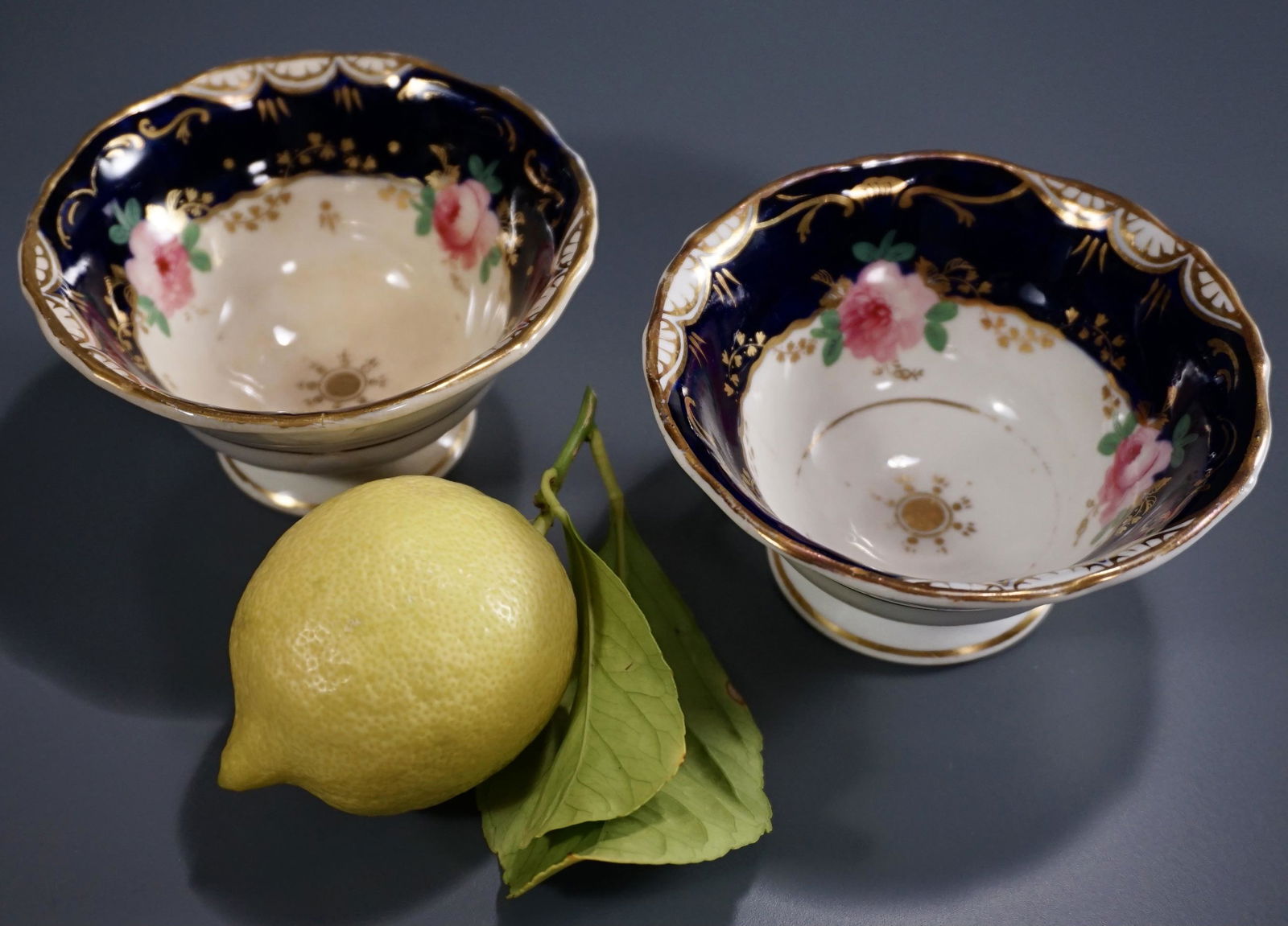 19 Century English Tea Cups Removed Handles Lot of 2: 19 Century English Tea Cups Removed Handles Lot of 2 Approximately 2 inches tall x 4 1/16 inches in diameter.