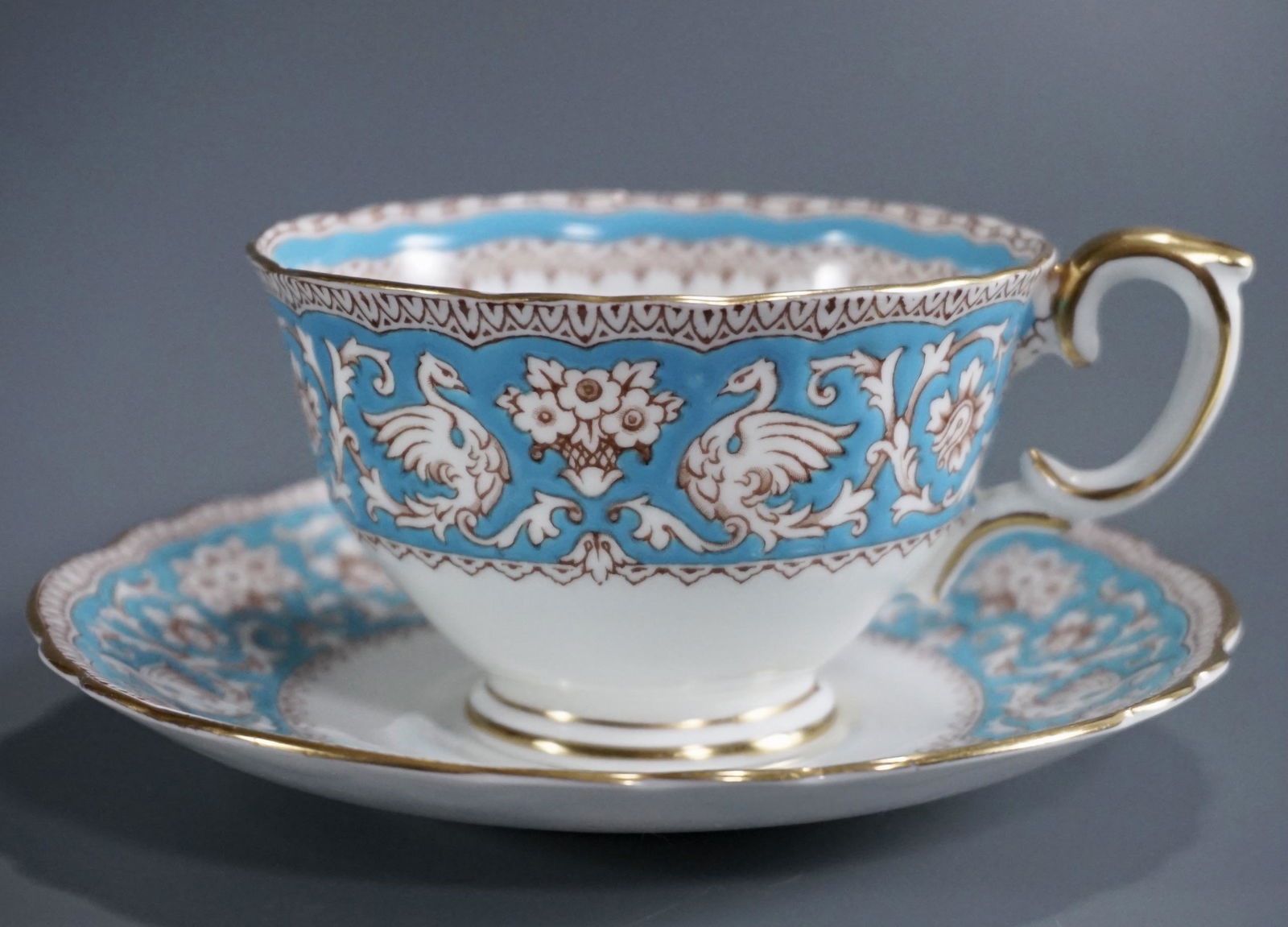 English Crown Staffordshire Ellesmere Blue Arabesque: English Crown Staffordshire Ellesmere Blue Arabesque Tea Cup Saucer Set Cup is approximately 4 5/8 x 4 11/16 x 2 1/4 inches tall; the saucer is approximately 5 5/8 inches in diameter.