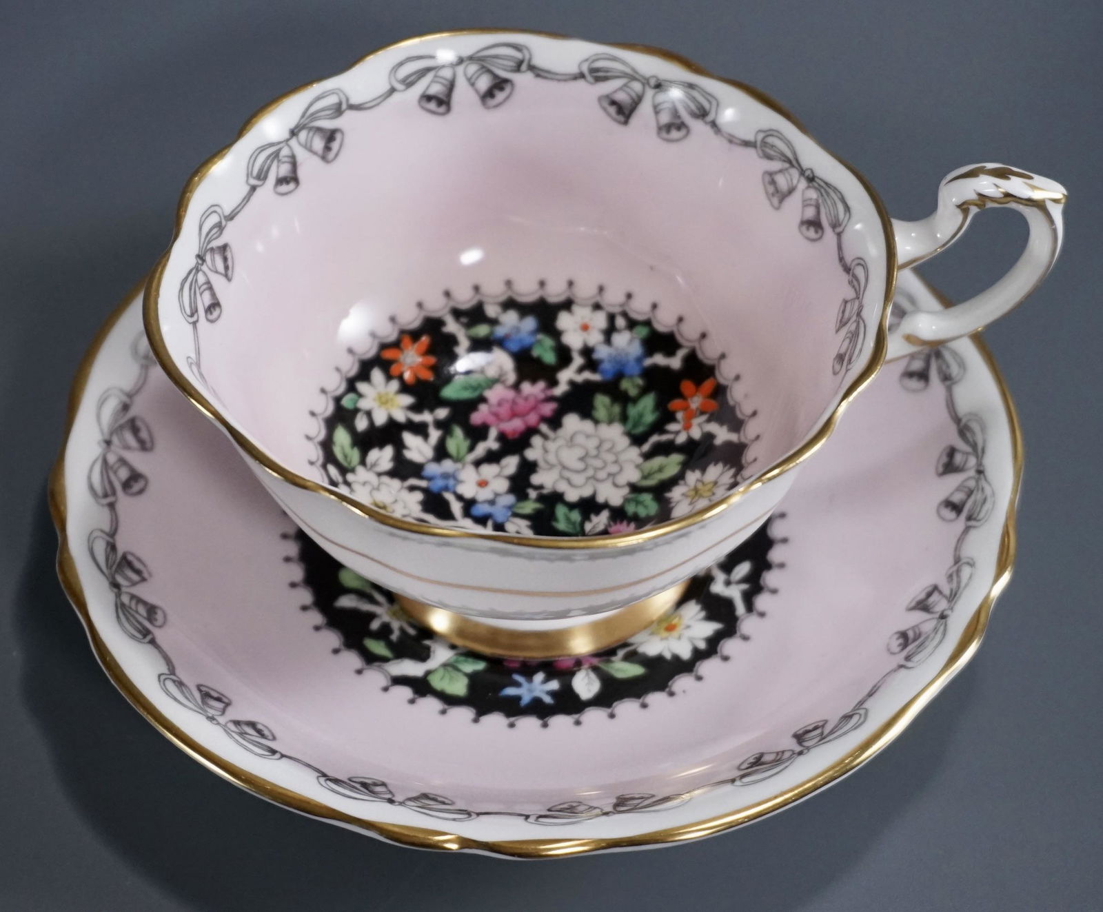 Paragon Fine Bone China Footed Tea Cup Saucer Set: Paragon Fine Bone China Footed Tea Cup Saucer Set England Cup is approximately 5 x 4 x 2 1/8 inches tall; the saucer is approximately 5 1/2 inches in diameter.