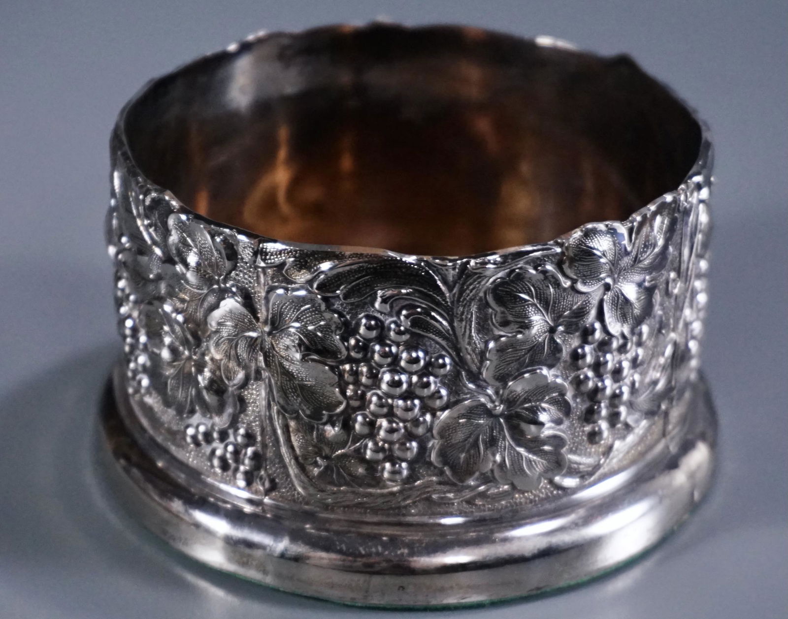 Vintage Silver Plated Wine Bottle Coaster Grape Theme: Vintage Silver Plated Wine Bottle Coaster Grape Theme Design Approximately 2 1/4 x 4 1/8 inches in diameter.