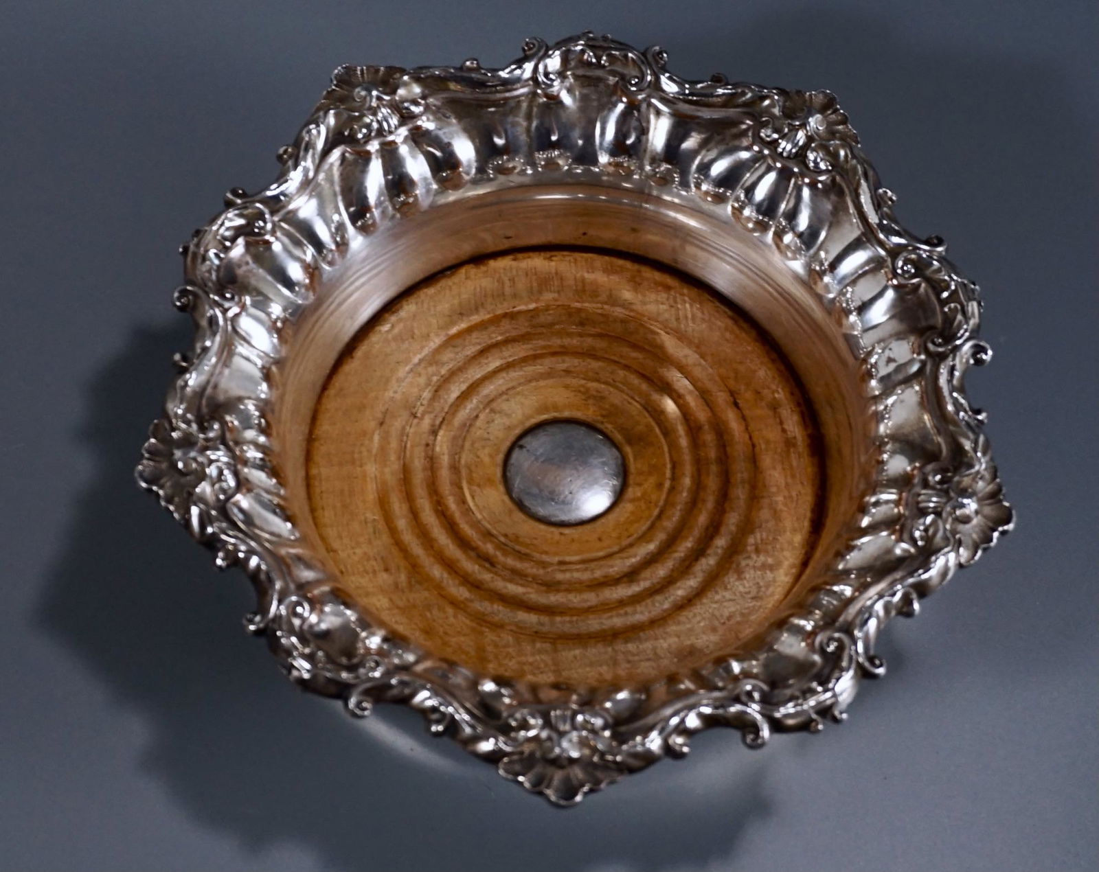 Antique English Silver on Copper Wine Bottle Coaster: Antique English Silver on Copper Wine Bottle Coaster Approximately 2 inches tall x 7 1/2 inches in diameter; approximately 4 5/8 inches inner diameter.