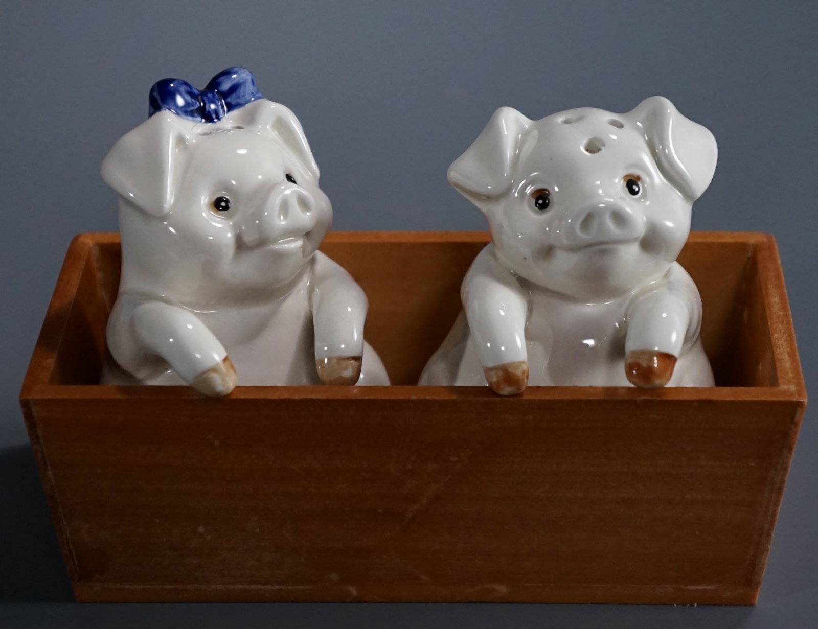 Pigs at the Trough Vintage Piggy Swain Salt Pepper: Pigs at the Trough Vintage Piggy Swain Salt Pepper Shaker Ceramic and Wood Set Made in Japan Approximately 5 1/4 x 2 3/8 x 4 inches tall overall.