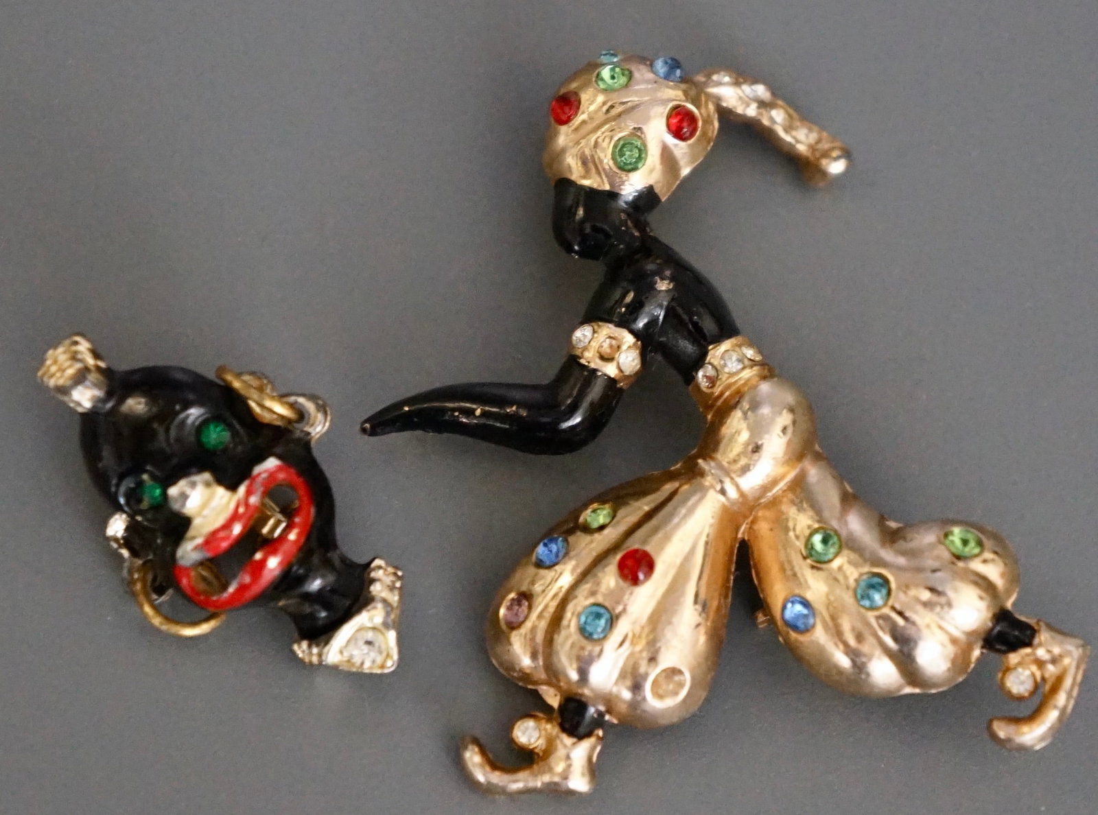 Blackmoore Pin Genie Brooch Vintage Early 50-s Costume Jewelry Lot of 2 Brooches: Blackmoore Pin Genie Brooch Vintage Early 50-s Costume Jewelry Lot of 2 Brooches Approximately 1 1/4 x 5/8 inches and 1 1/8 x 1 3/4 inches. Shipping Estimate: SHIPTHEBAY estimate for shipping of this 
