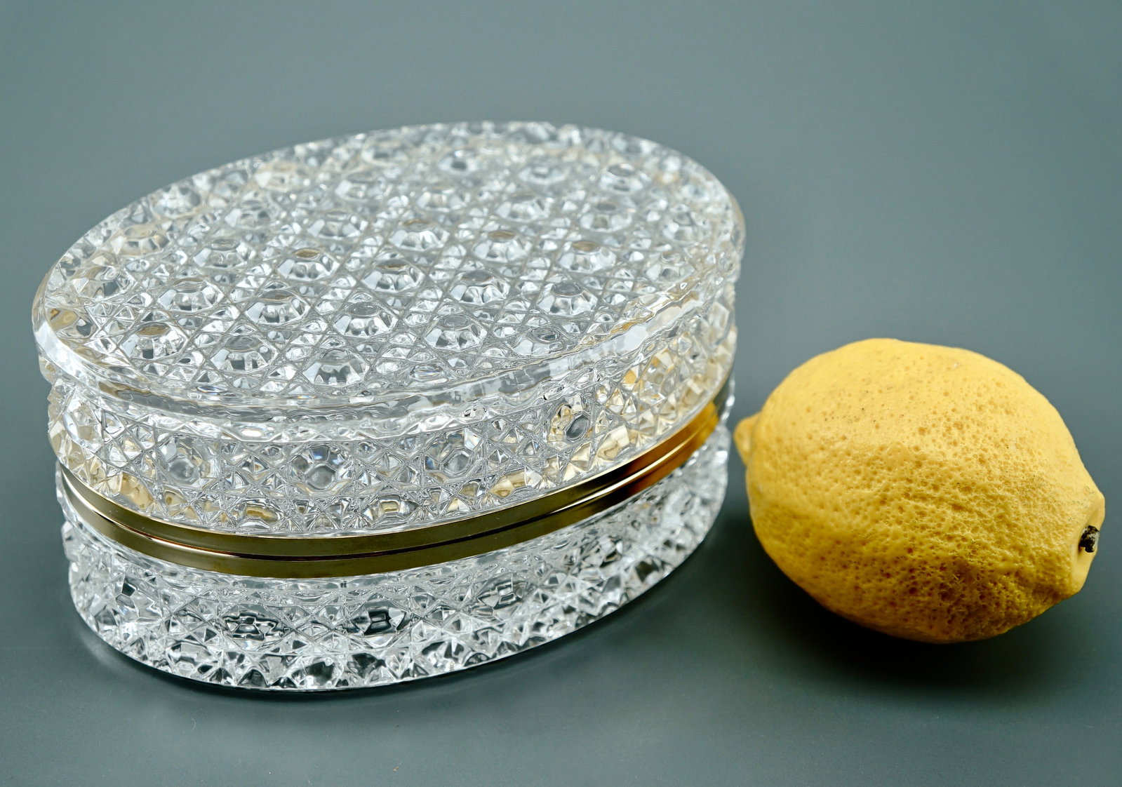 Oval Hinged Jewelry Casket Continental Glass Vanity Box: Oval Hinged Jewelry Casket Continental Glass Vanity Box Approximately 4 3/8 x 6 x 2 7/8 inches tall. Shipping Estimate:SHIPTHEBAY estimate for shipping of this lot in the Continental US is $20, which 