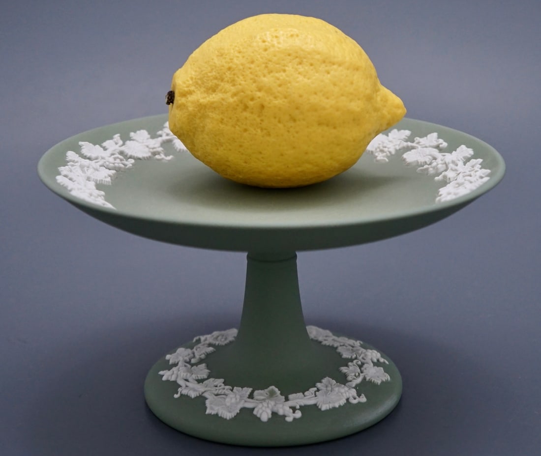 Signed John Wedgwood 1965 Wedgwood Sage Green Jasperware Footed Dish Impressed with Wedgwood Made in: Signed John Wedgwood 1965 Wedgwood Sage Green Jasperware Footed Dish Impressed with Wedgwood Made in England Marks on the bottom. Approximately 3 7/16 inches tall x 6 1/4 inches in diameter. Shipping