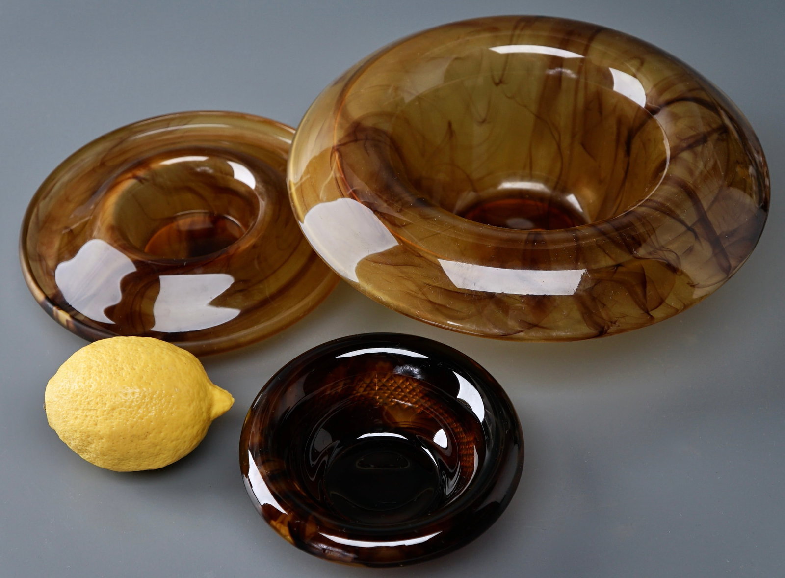 Davidson Cloud Art Deco Amber Glass Bowl Lot of 3: Davidson Cloud Art Deco Amber Glass Bowl Lot of 3 Approximately 5, 7 and 9 1/2 inches in diameter. Shipping Estimate:SHIPTHEBAY estimate for shipping of this lot in the Continental US is $20, which in