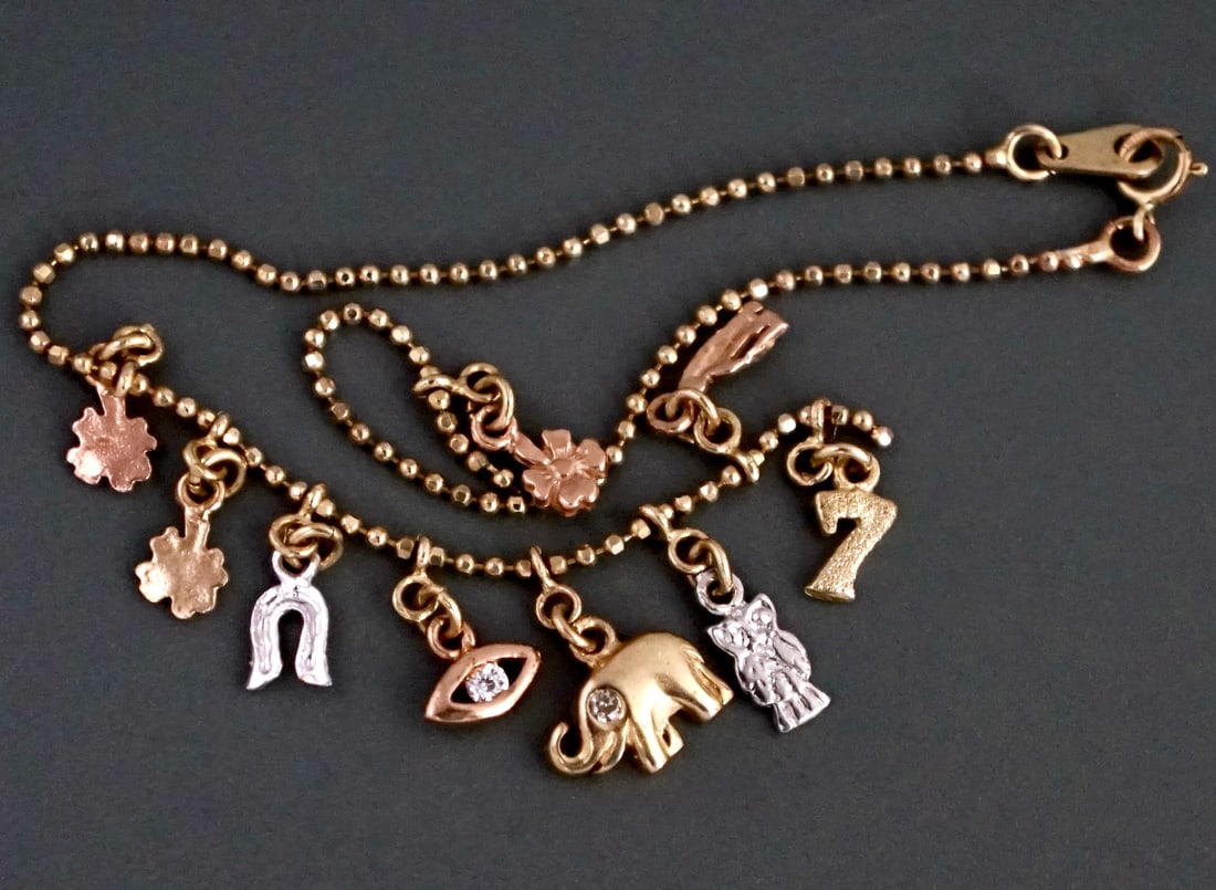 Charm Bracelet 14K Marked Gold Chain Diamond Jeweled Evil Eye Elephant Multi Colored Gold Owl Lucky: Charm Bracelet 14K Marked Gold Chain Diamond Jeweled Evil Eye Elephant Multi Colored Gold Owl Lucky Number 7 Bird 4-Leaf Clover etc. Total of Nine Small Lucky Charms Approximately 7 3/4 inches long si