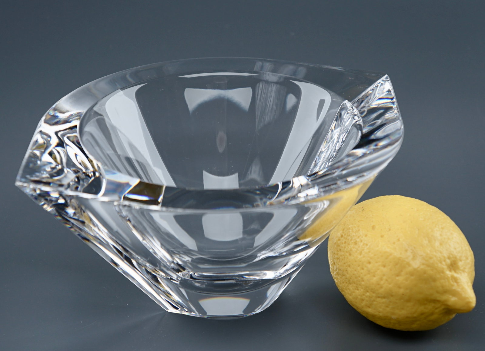 Orrefors Signed Crystal Bowl: Orrefors Signed Crystal Bowl Approximately 8 1/4 x 6 3/4 x 3 3/4 inches tall. Shipping Estimate:SHIPTHEBAY estimate for shipping of this lot in the Continental US is $20, which includes pick up, packi