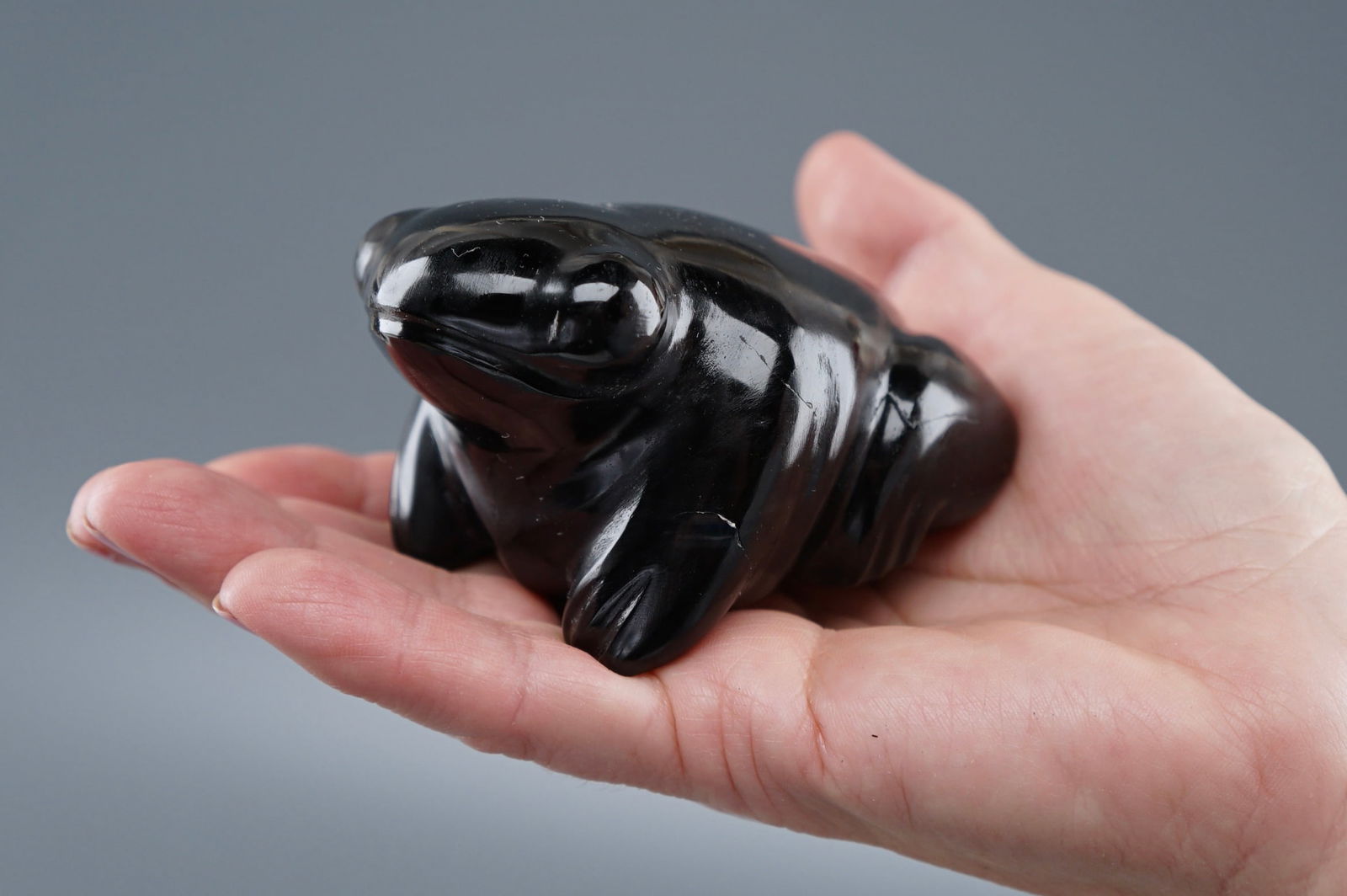 Black Obsidian Frog Natural Stone Carved Toad: Black Obsidian Frog Natural Stone Carved Toad Approximately 3 1/2 x 2 1/4 x 1 7/8 inches. Shipping Estimate:SHIPTHEBAY estimate for shipping of this lot in the Continental US is $20, which includes pi