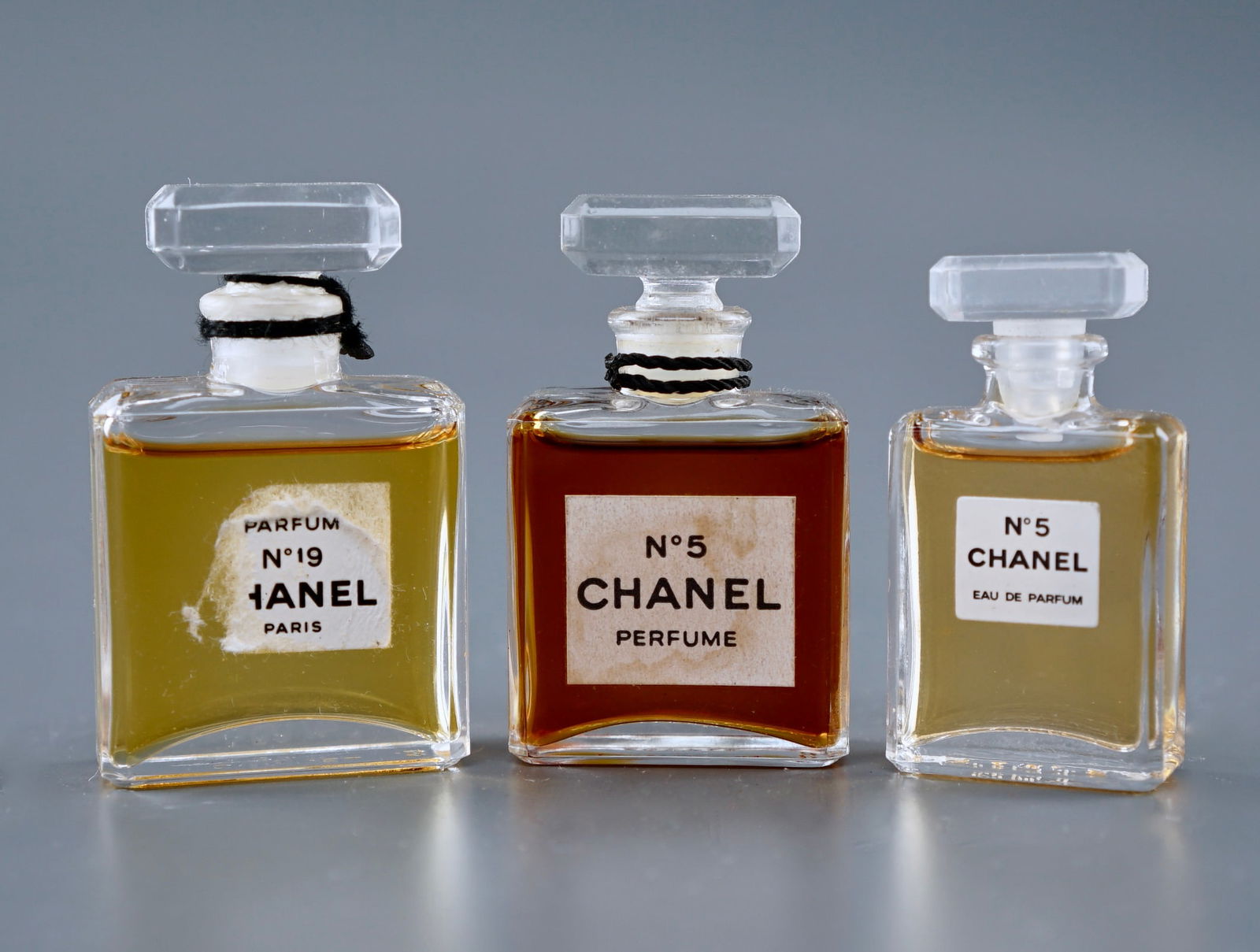 Vintage Chanel No 5 No 19 Perfume Bottles: Vintage Chanel No 5 No 19 Perfume Bottles Approximately 1 7/8 - 2 1/8 inches tall. Shipping Estimate:SHIPTHEBAY estimate for shipping of this lot in the Continental US is $20, which includes pick up,