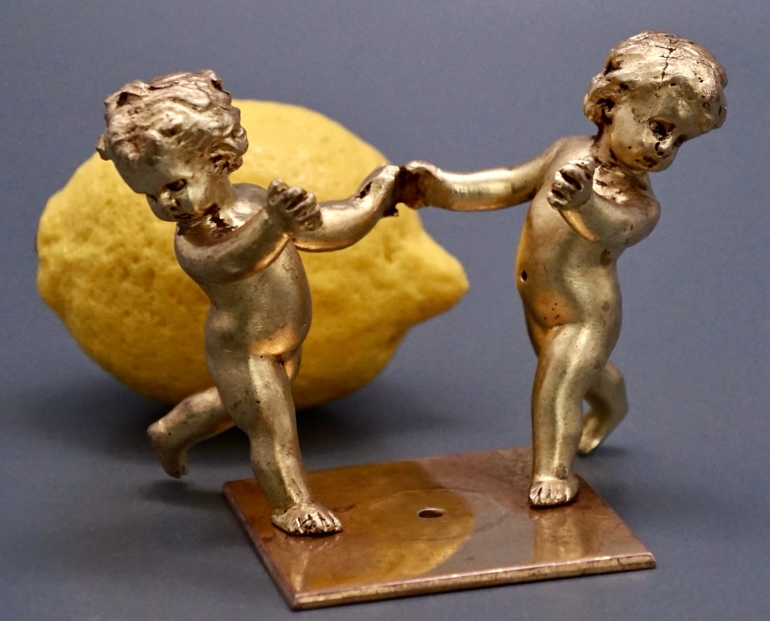 Antique Bronze Putti Cherubs Figurine French Clock Part Holder: Antique Bronze Putti Cherubs Figurine French Clock Part Holder Approximately 3 1/2 x 2 7/8 x 3 1/4 inches tall overall; approximately 2 7/16 x 2 7/16 inches base. Shipping Estimate:SHIPTHEBAY estimate