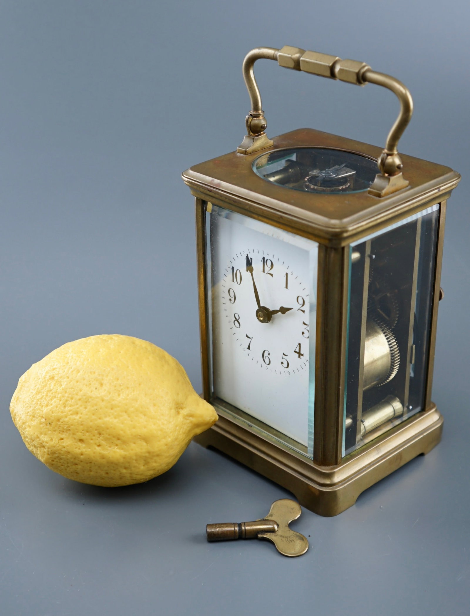 French Brass Beveled Glass Carriage Clock Striking Half Hour & Hours Working Movement Marked Made in: French Brass Beveled Glass Carriage Clock Striking Half Hour & Hours Working Movement Marked Made in France Approximately 3 1/2 x 3 1/8 x 4 7/8 inches tall without the handle, 6 1/2 inches tall overal
