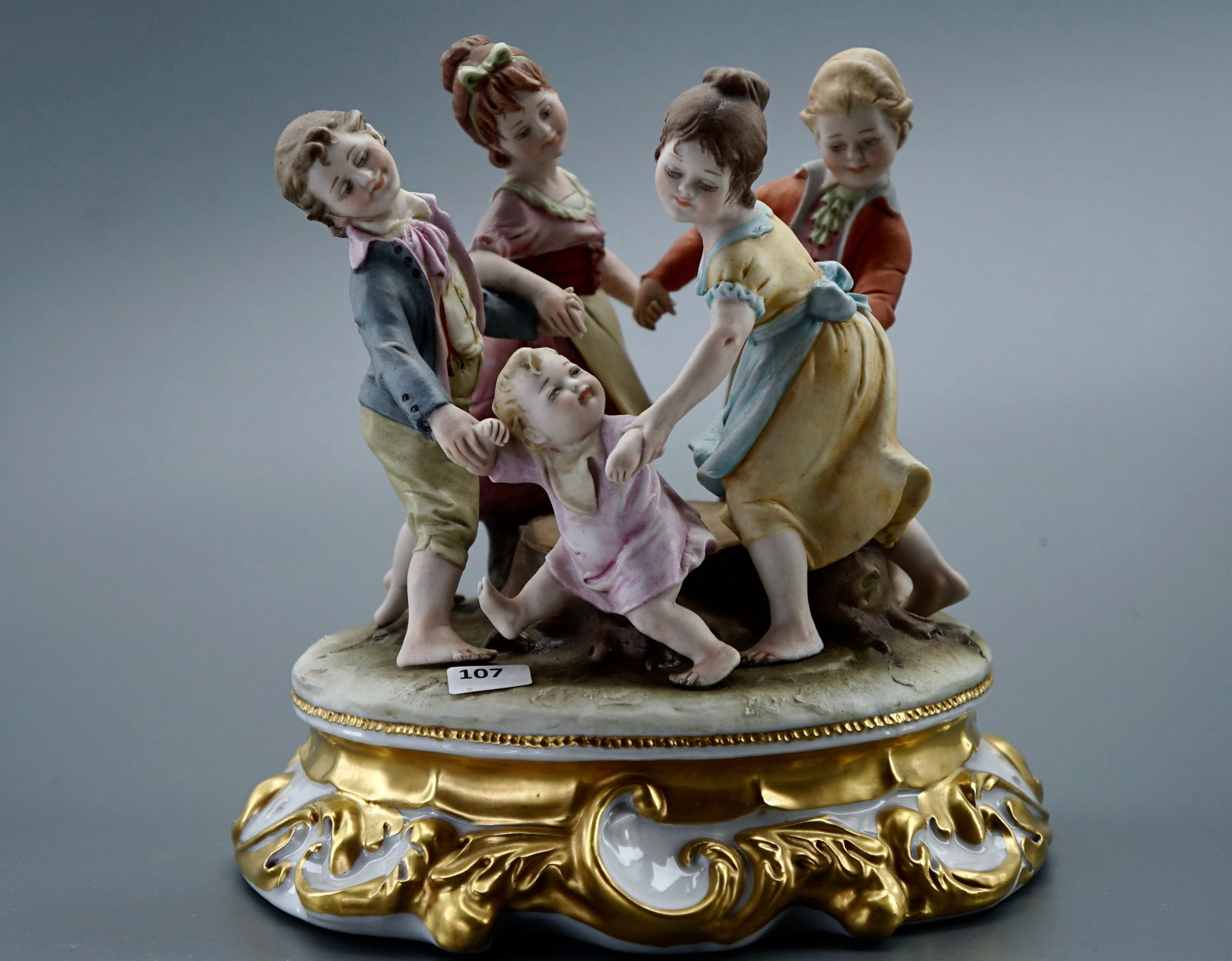 Bruno Merli Italian Bambini Vintage Painted Bisque Porcelain Sculpture on Glazed Base Detailed: Bruno Merli Italian Bambini Vintage Painted Bisque Porcelain Sculpture on Glazed Base Detailed Figural Group Playful Children Marked With Painted Letter N and Five Prong Crown Capodimonte Italy c.1960