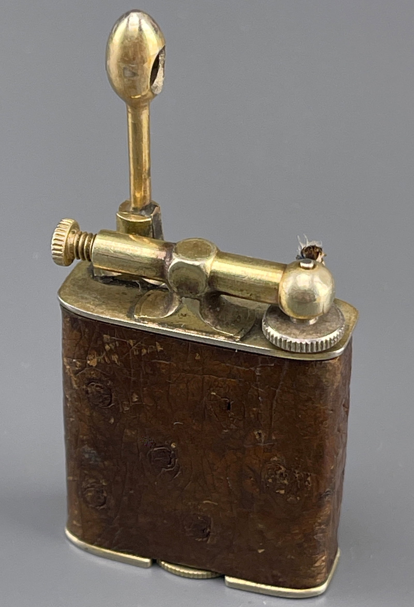 Vintage Clark Windodger Lift Arm Lighter Ostrich Leather on 18k Gold Plated Body Art Deco 1920-1930: Vintage Clark Windodger Lift Arm Lighter Ostrich Leather on 18k Gold Plated Body Art Deco 1920-1930 s Period Cigarette Petrol Lighter Approximately 1 7/8 x 1 7/16 x 5/16 inches overall. SHIPPING & PIC