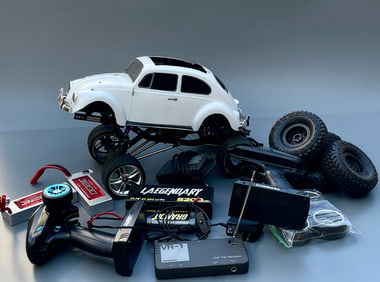 Radio Controlled Race Car with extra battery packs and some accessories as pictured