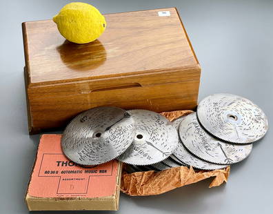 Vintage Thorens Wind Up Music Box Made in Switzerland 12 Disks Set: Vintage Thorens Wind Up Music Box Made in Switzerland 12 Disks Music Player Set The walnut case measures approximately 10 7/8 x 6 1/4 x 4 inches tall overall.
