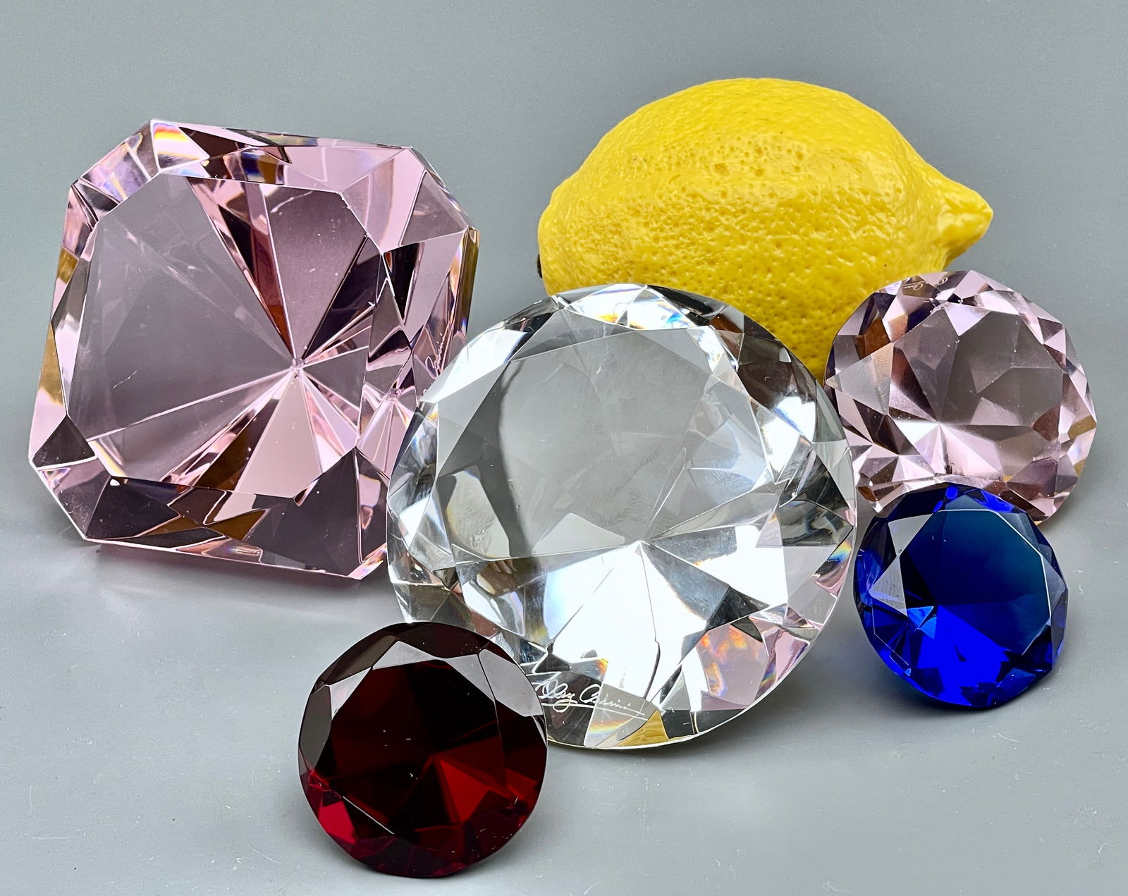 Sparkler Gem Paperweight Oleg Cassini Faceted Crystal Lot of 5 Diamond Cut Large Rhinestones: Sparkler Gem Paperweight Oleg Cassini Faceted Crystal Lot of 5 Diamond Cut Large Rhinestones Approximately from 1 5/8 to 3 1/2 inches measured across.