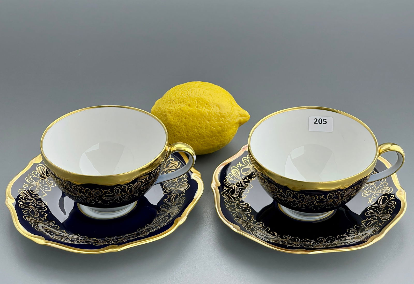 Vintage German Gilded Cobalt Porcelain Tea Cup & Saucer Lot of 2 Echt Weimar Kobalt Tea Sets Made in: Vintage German Gilded Cobalt Porcelain Tea Cup & Saucer Lot of 2 Echt Weimar Kobalt Tea Sets Made in Germany c 1960 Cups are approximately 4 1/2 x 3 3/4 x 2 3/8 inches tall, the saucers approximately