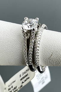 18 Karat Designer A.Jaffe Signature Engagement & Wedding Ring Set 0.54 ctw Side Diamonds & Space for: 18 Karat Designer A.Jaffe Signature Engagement & Wedding Ring Set 0.54 ctw Side Diamonds & Space for a 1.0 Diamond Currently Set in Center with a Round CZ Set of 2 Size 6 Rings